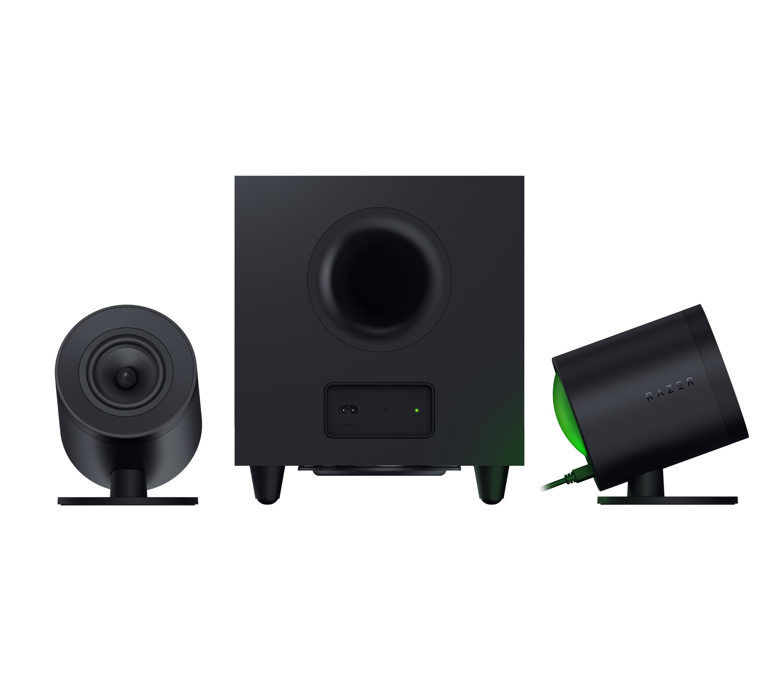 Subwoofer negro con dos altavoces, iluminado con luz verde.