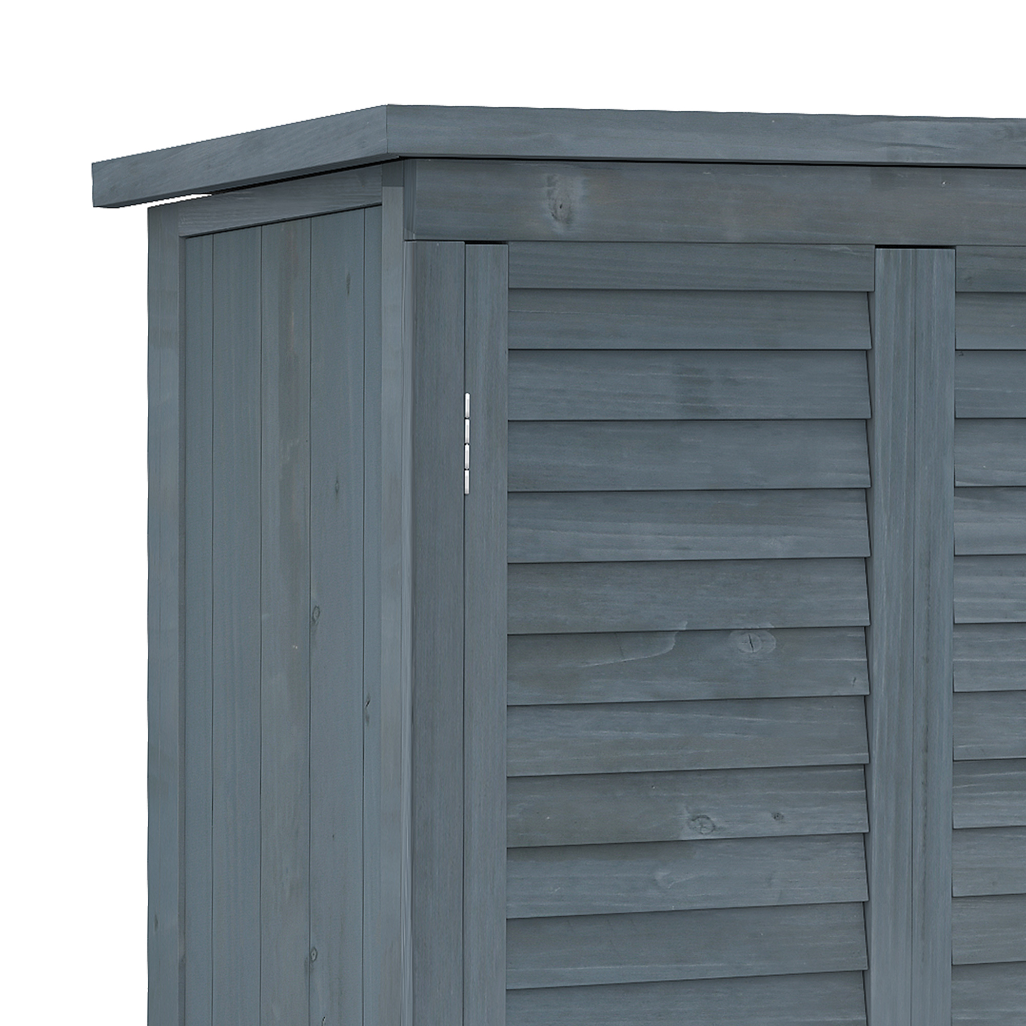 Dettaglio di capanno in legno grigio con porta a doghe e tetto sporgente.