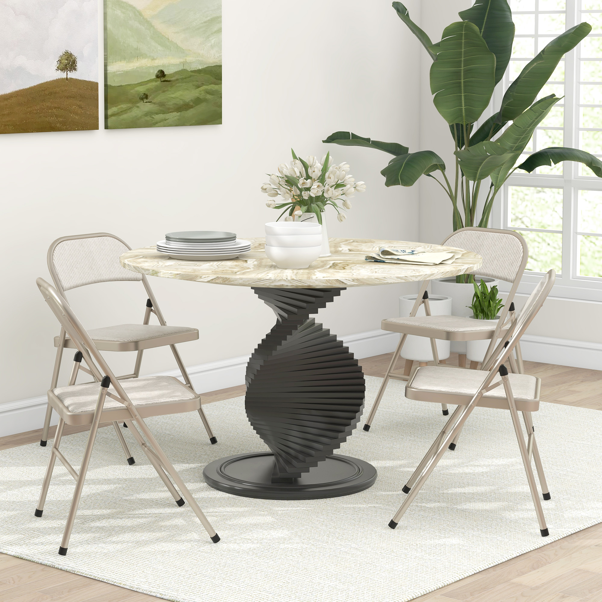 Tavolo da pranzo rotondo con base a spirale, quattro sedie, fiori e quadri.