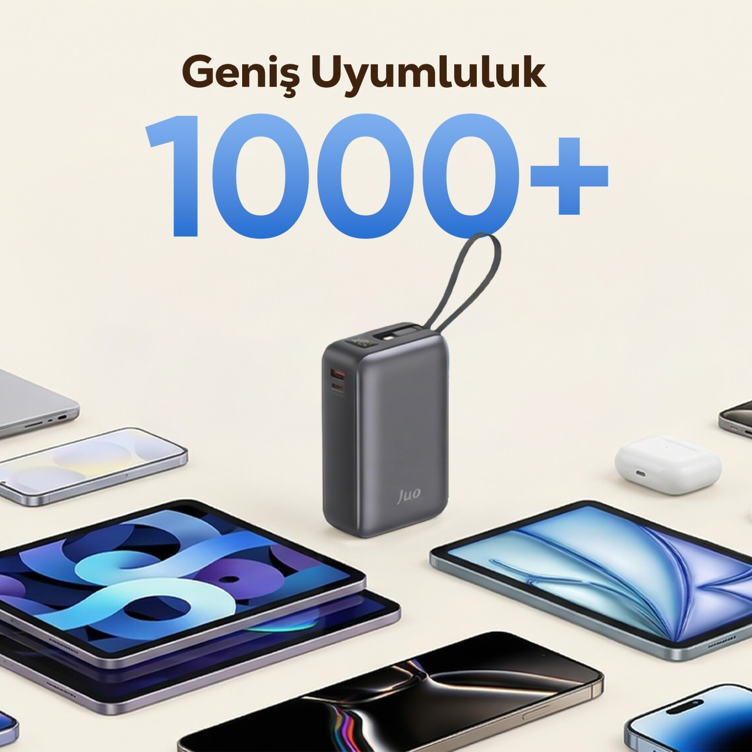 Gri powerbank, tabletler, telefonlar ve kulaklıklarla çevrili.