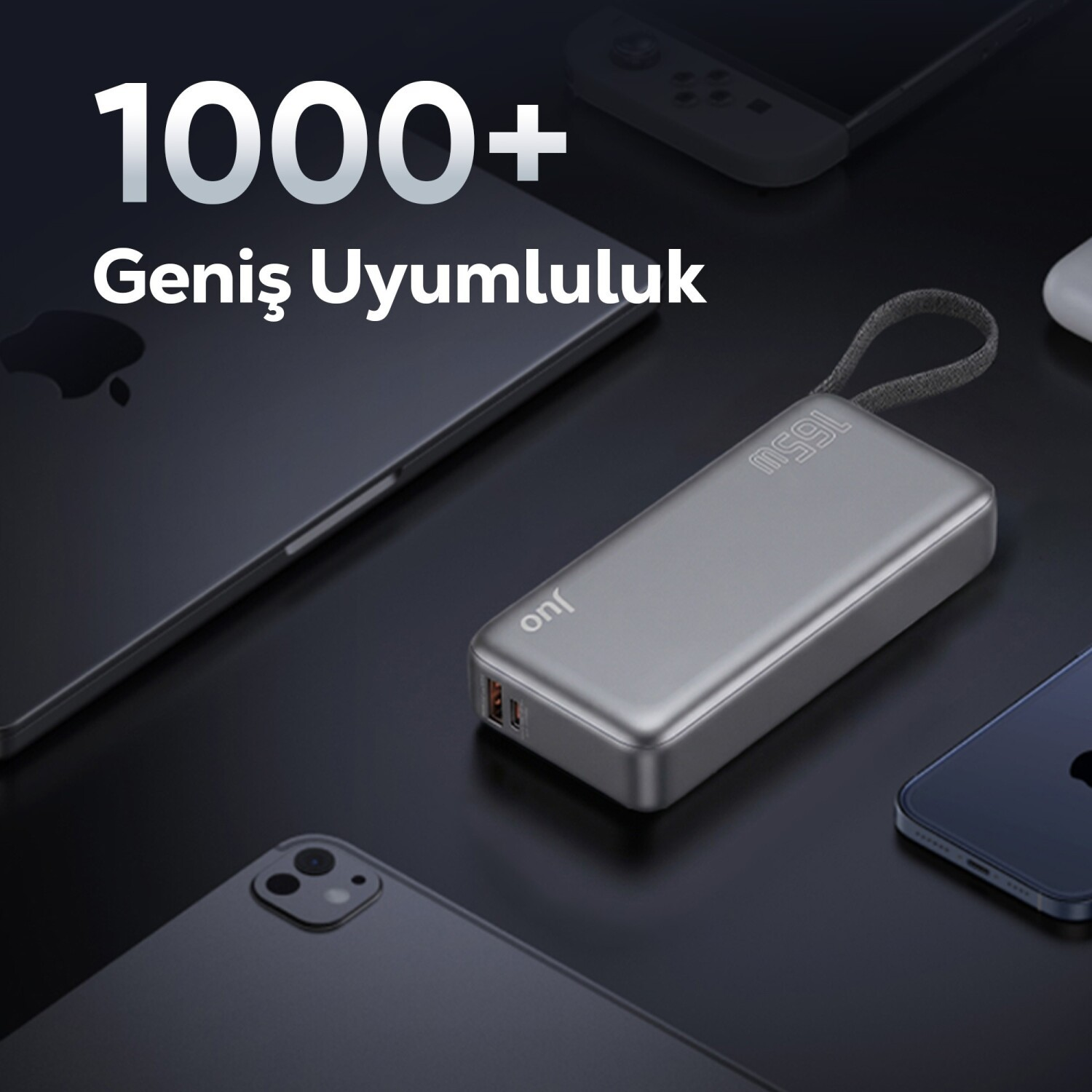 Gümüş renkli 165W güç bankası, Apple laptop, telefon ve oyun kumandası üzerinde.