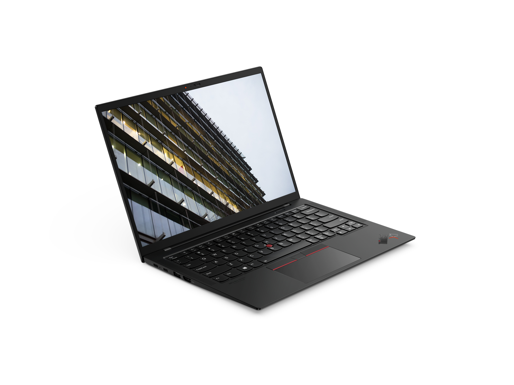 A black Lenovo ThinkPad laptop with a modern building displayed on its screen.