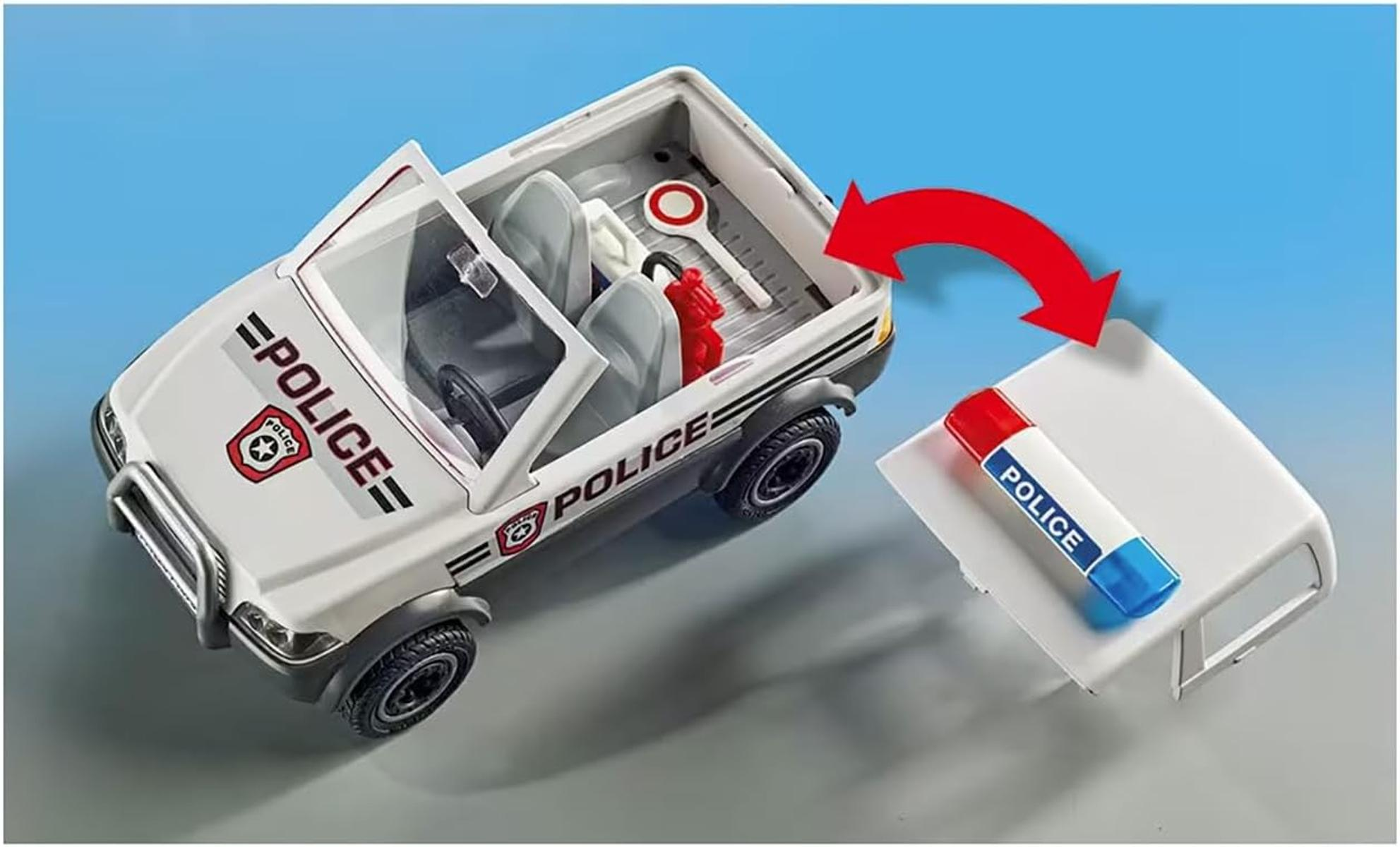 Coche de policía de juguete blanco con detalles y calcomanías rojas y azules.