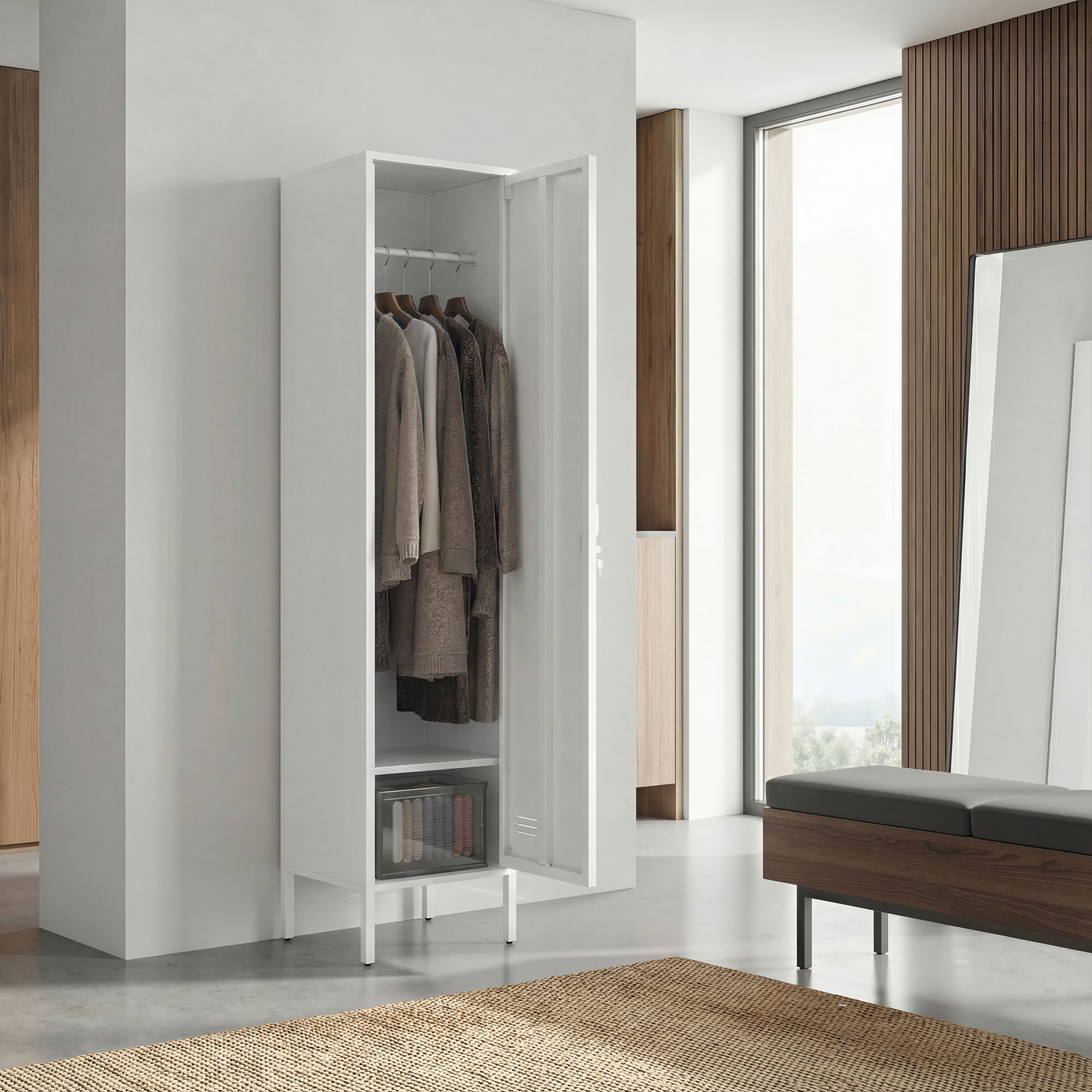 Un armadio bianco con vestiti e libri, accanto a una finestra e una panca di legno.