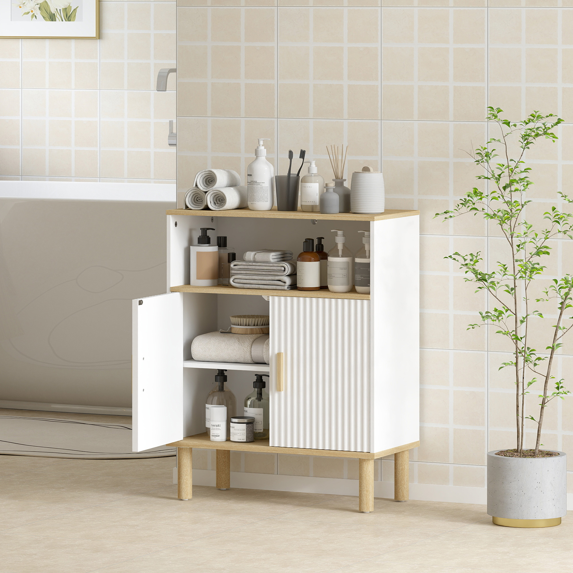 Un mobiletto bianco da bagno con gambe in legno su pavimento beige.