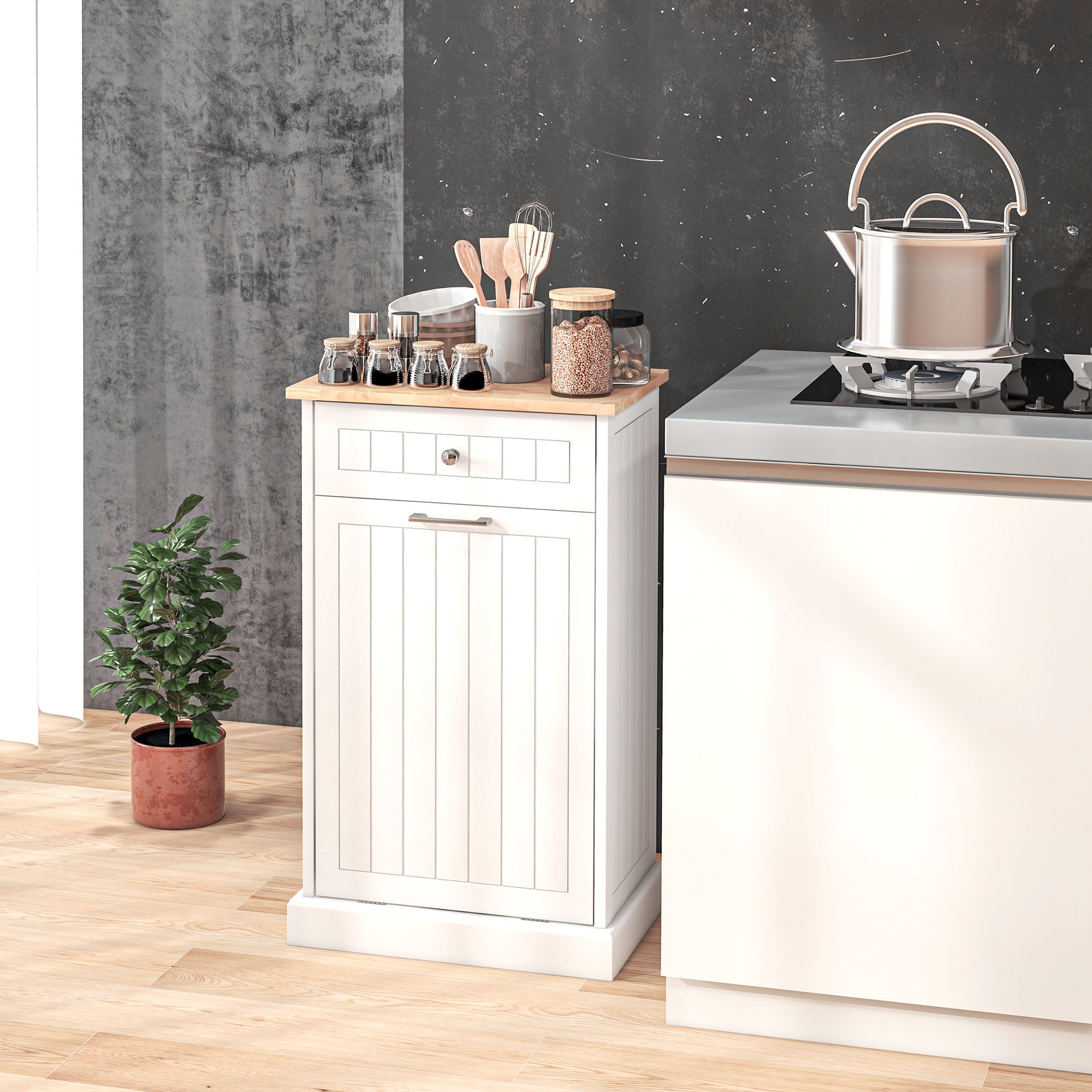 Una cucina bianca con fornello a gas, carrello laterale e pianta in vaso.