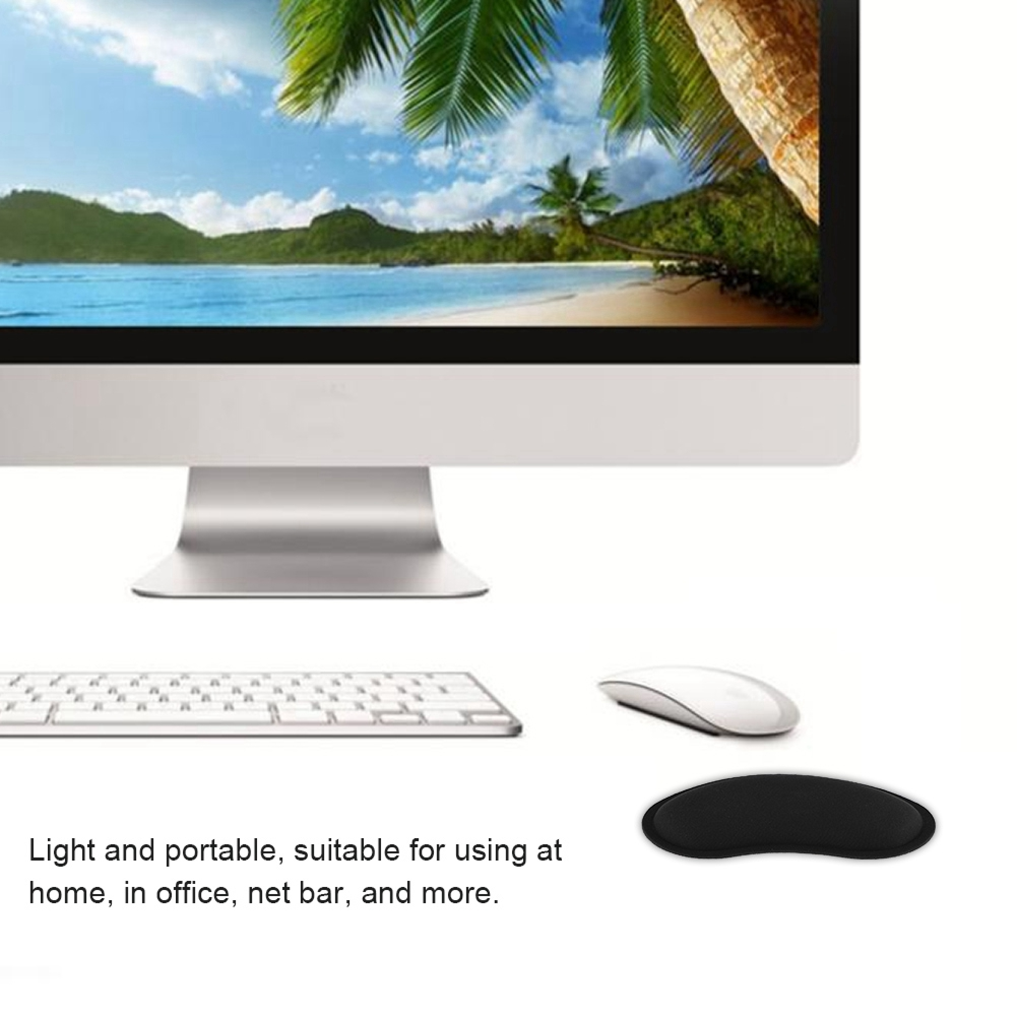 Ein Computerbildschirm mit tropischem Strandmotiv, Tastatur, Maus und Handgelenkauflage.