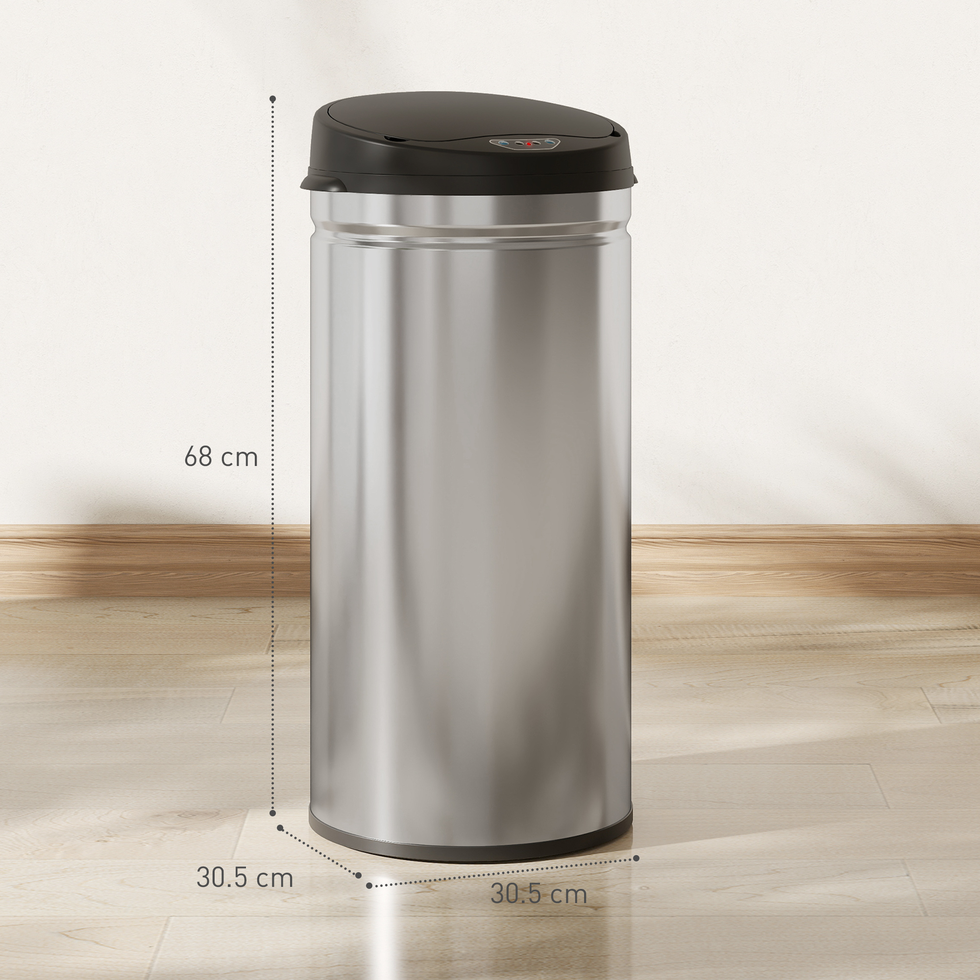 Un cestino d'argento con coperchio nero si trova su un pavimento in legno.