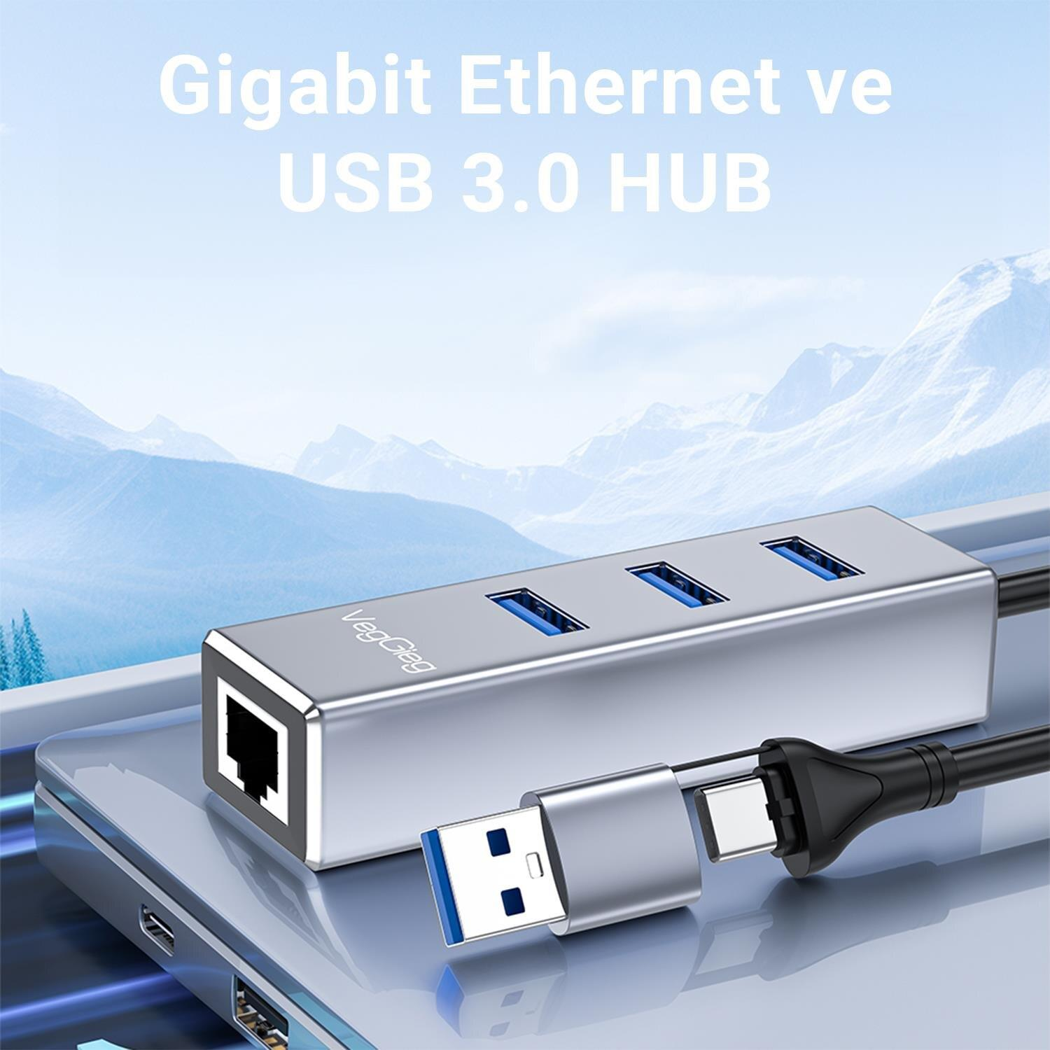 Gümüş USB 3.0 hub Ethernet portlu ve USB-C kablolu dizüstü bilgisayarda.