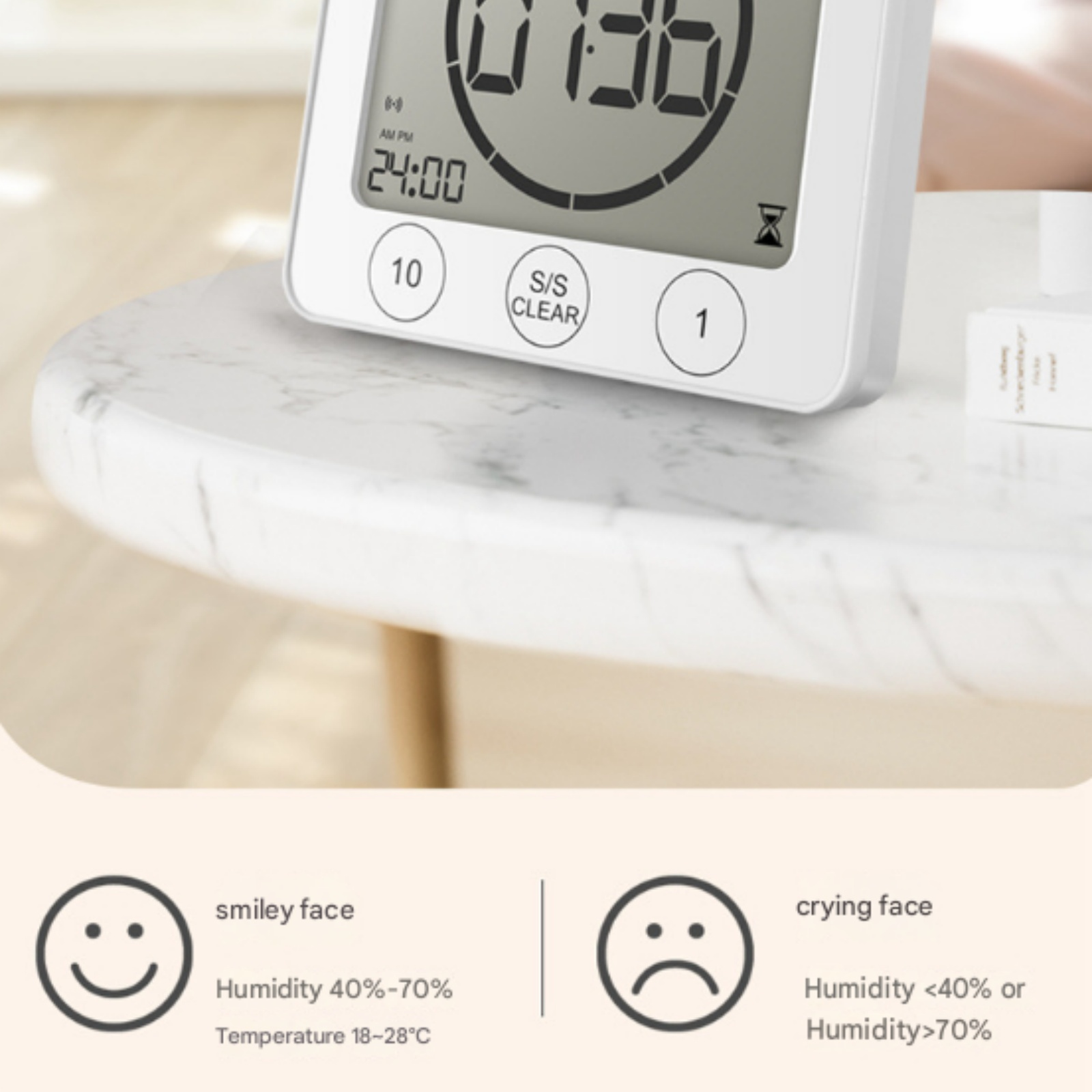 Weißer Digitaltimer auf Marmortisch zeigt 24:00. Darunter Symbole für Luftfeuchtigkeit.