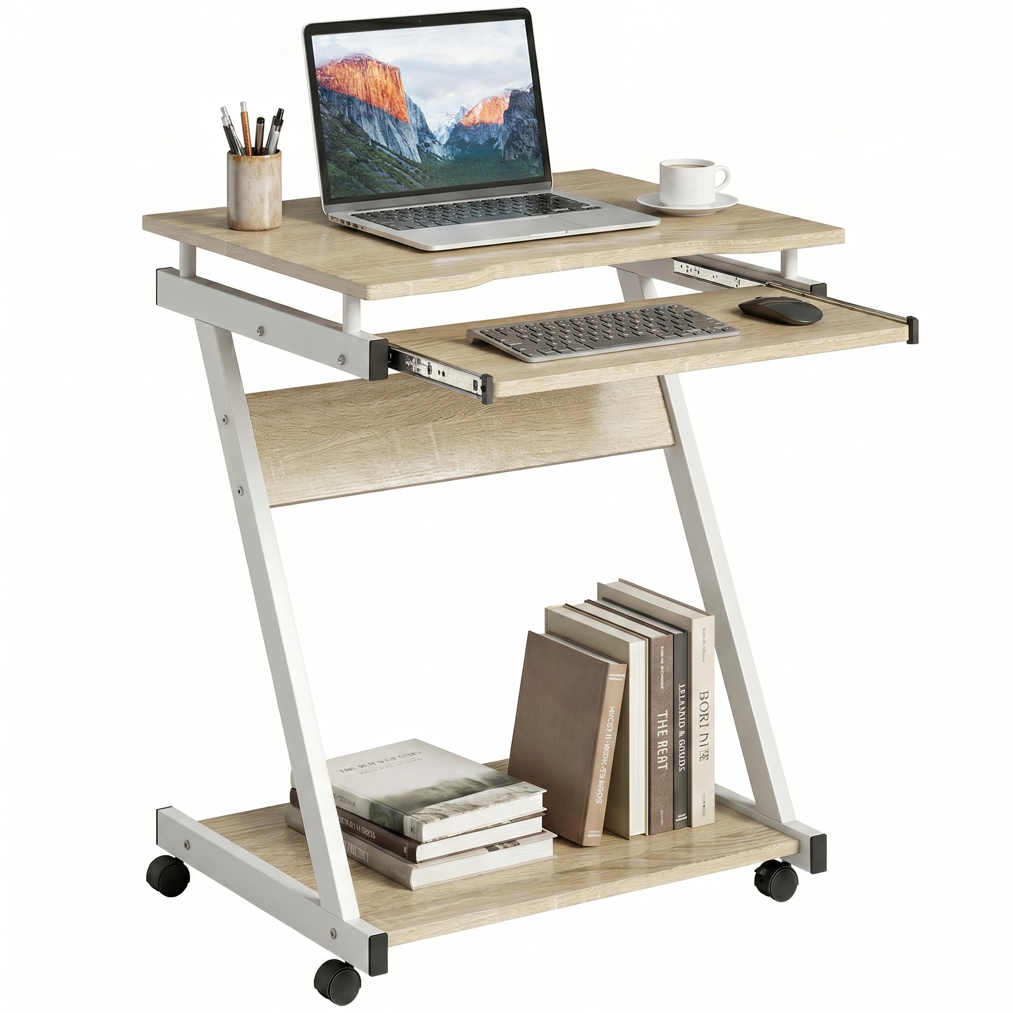 Un laptop su una scrivania su ruote con tastiera, mouse, tazza e libri.