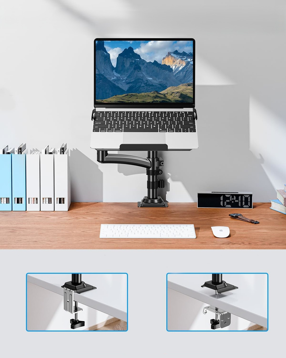 Laptop na stojaku na ramię nad biurkiem z klawiaturą i myszą.