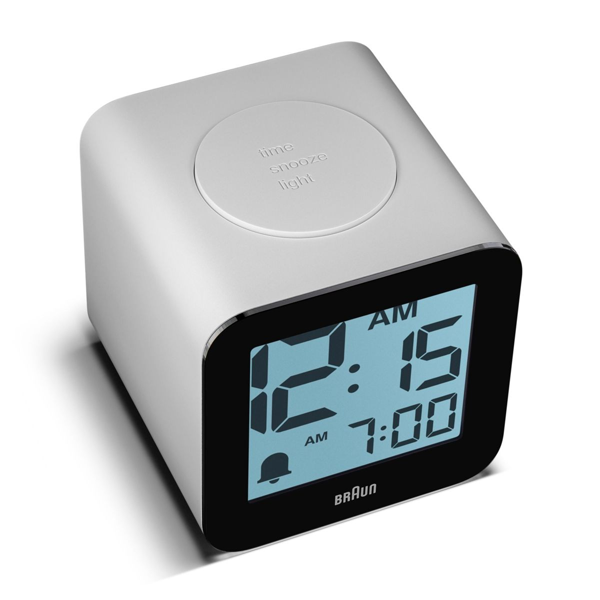 Ein digitaler Wecker mit blauem Display zeigt 12:15 und 7:00 an.