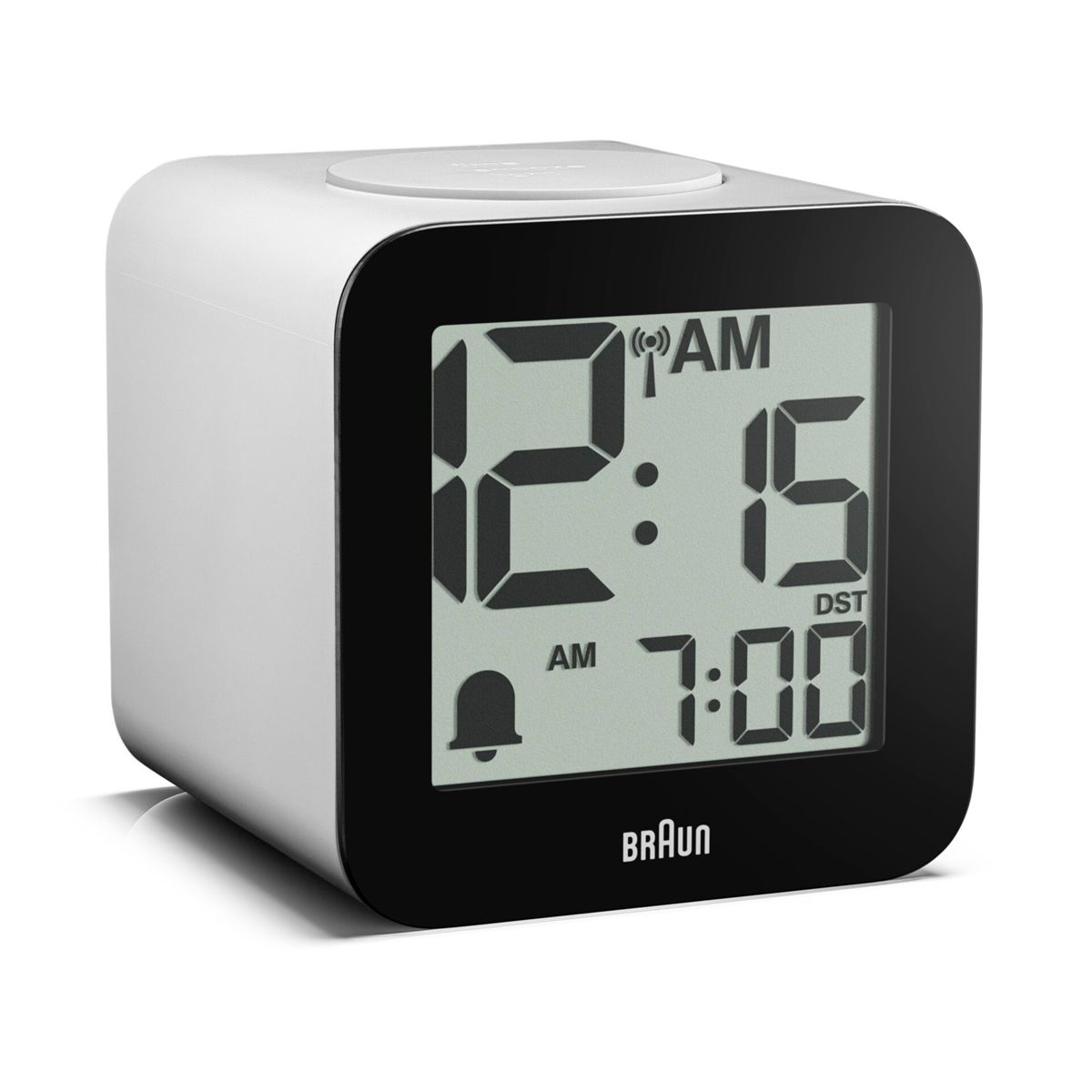 Ein weißer digitaler Wecker zeigt 12:15 AM und 7:00 AM an.