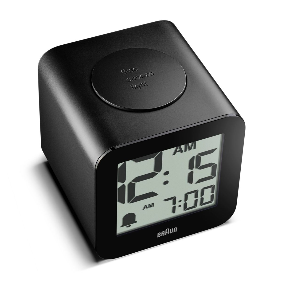 Ein schwarzer Braun Digitalwecker zeigt 12:15 AM und 7:00 Uhr.