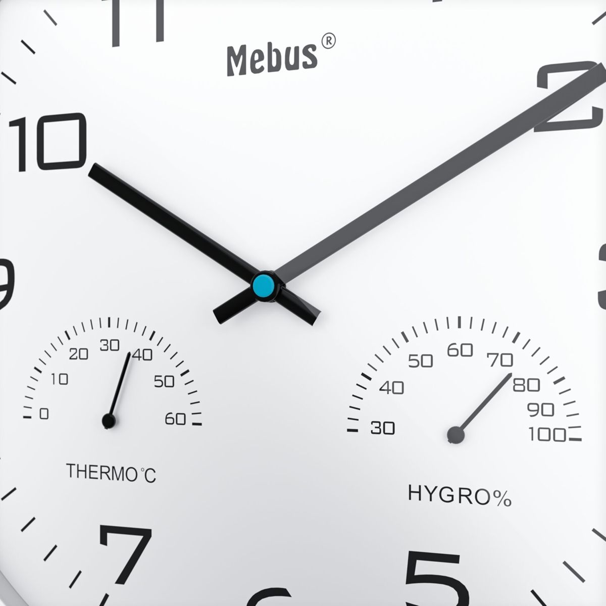 Eine Mebus-Uhr mit Thermometer und Hygrometer. Zeiger bei 10:08 und 38% Hygrometer.