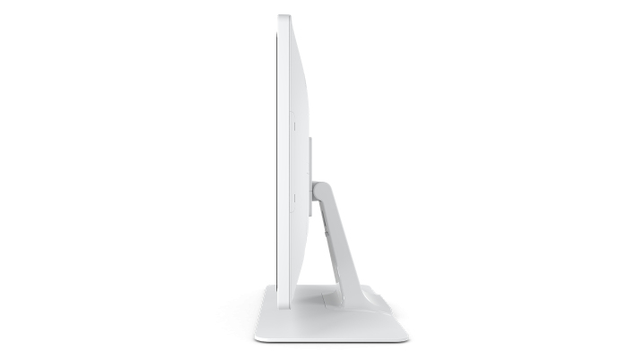 Un monitor di computer bianco visto di lato su sfondo bianco.