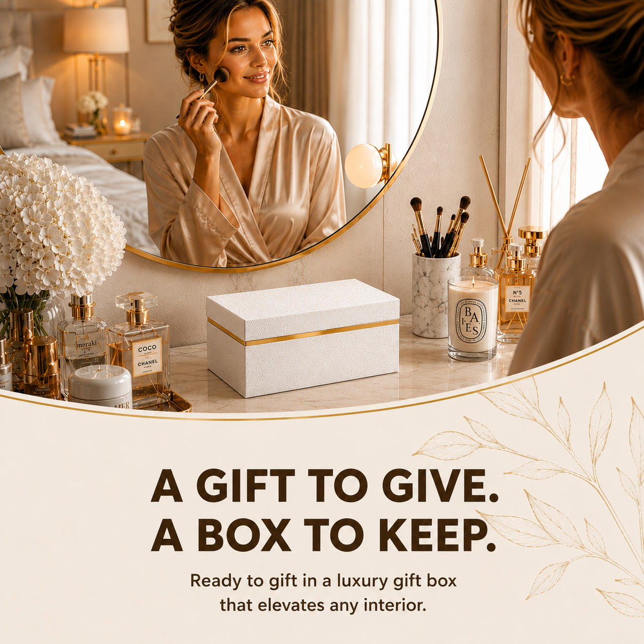 A woman applies makeup in a mirror, with perfumes, candles, and a gift box on the vanity.