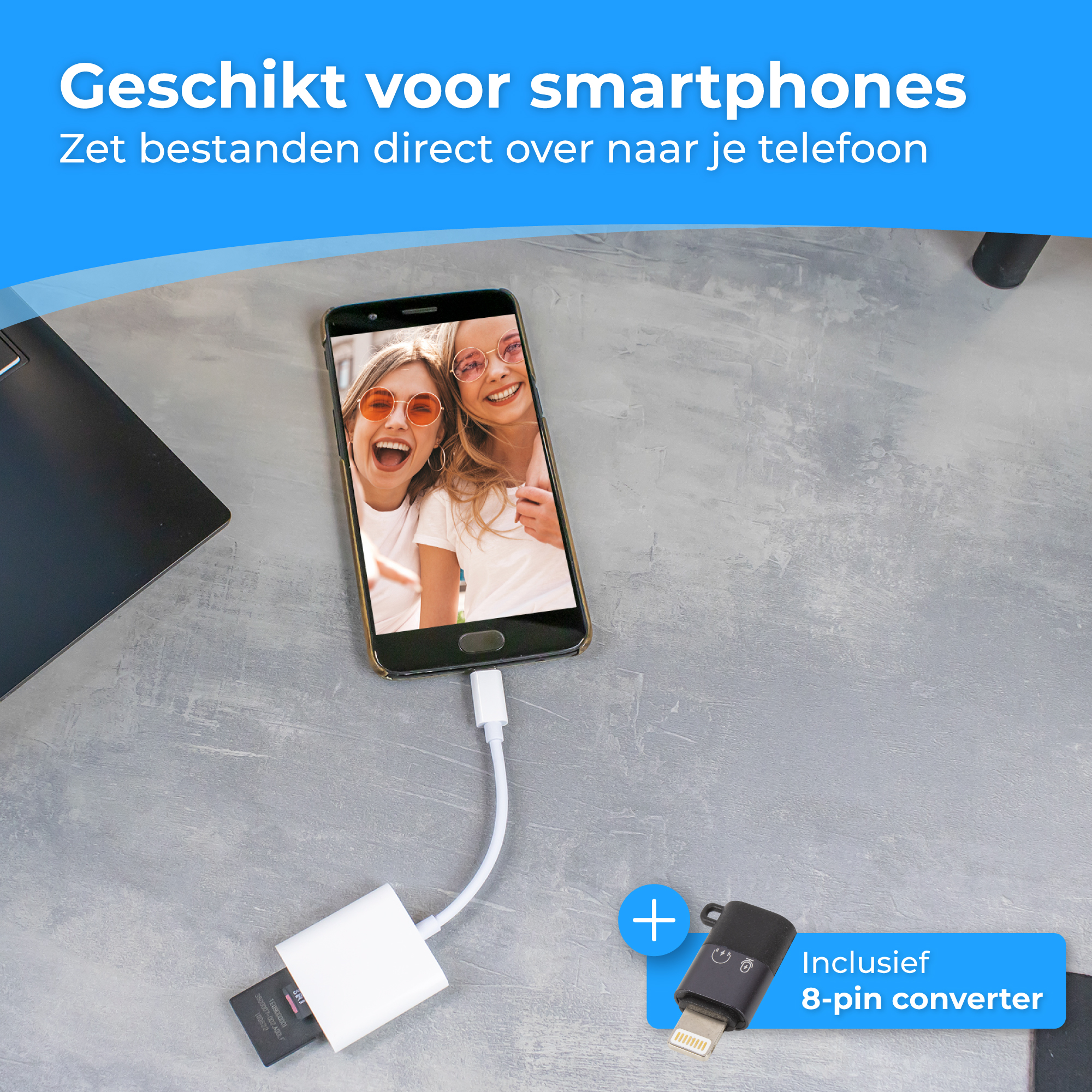 Smartphone with adapter cable connected to a laptop.