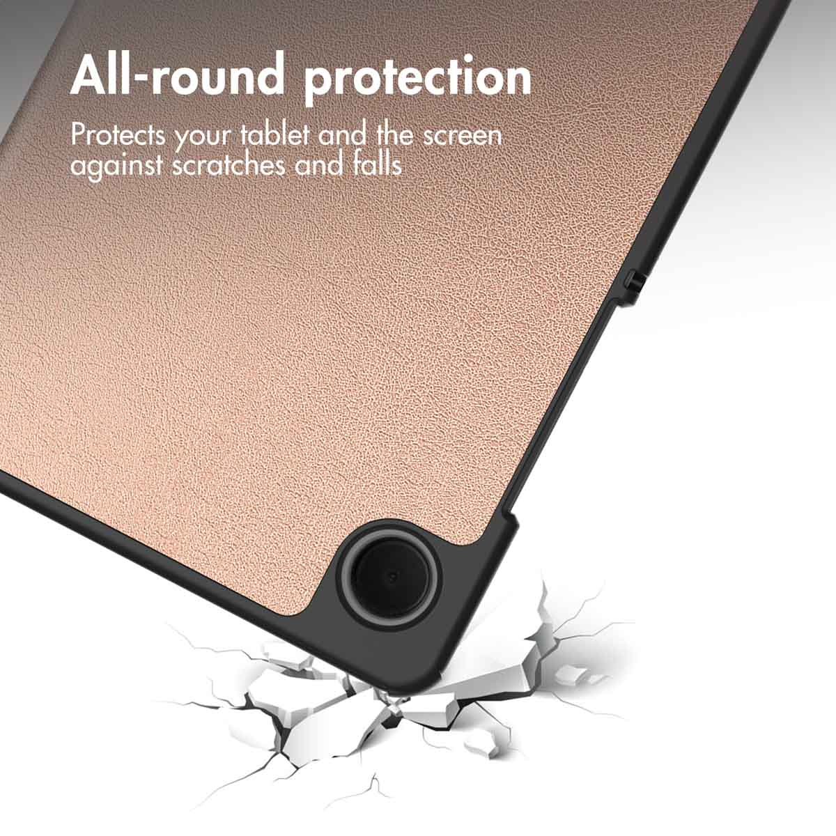 A rose gold tablet case with black trim falls onto cracked white surfaces.