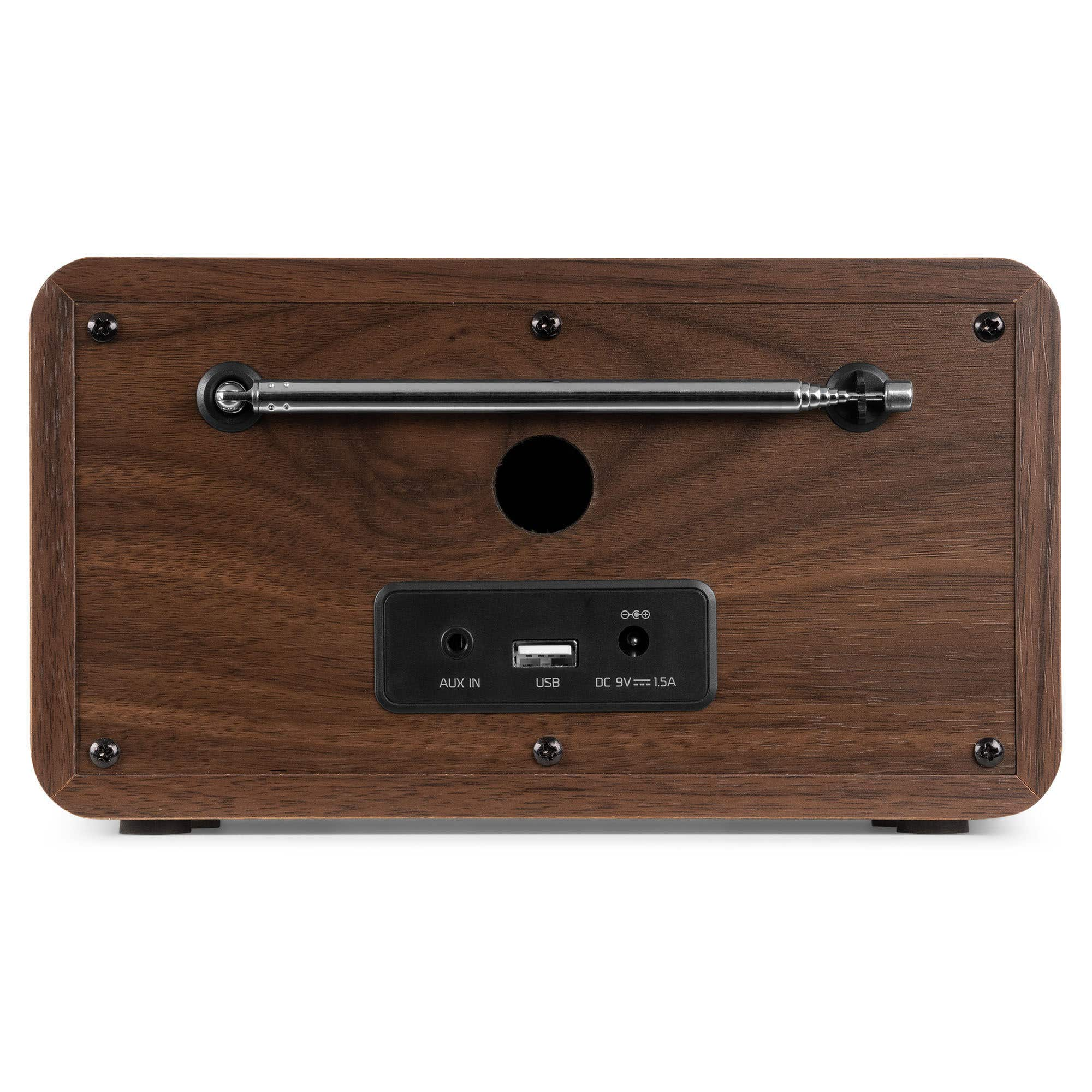 Arrière d'une radio en bois avec antenne rétractable et ports.