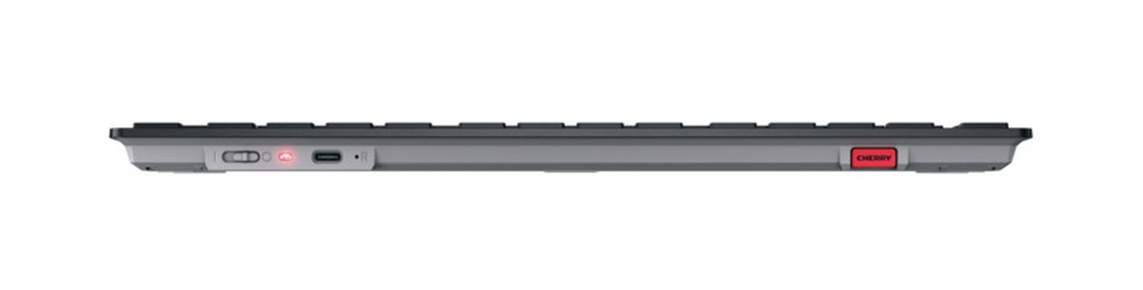 Vista lateral de teclado gris con USB-C, luz roja y logo CHERRY.