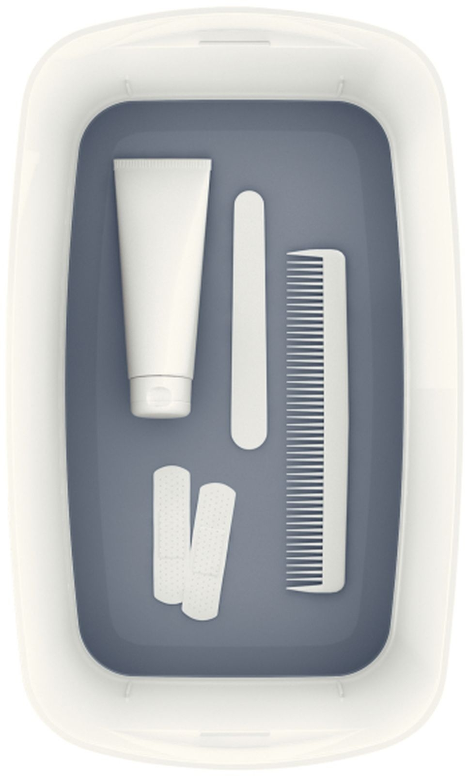 Tube blanc, peigne, lime à ongles et pansements dans un contenant.