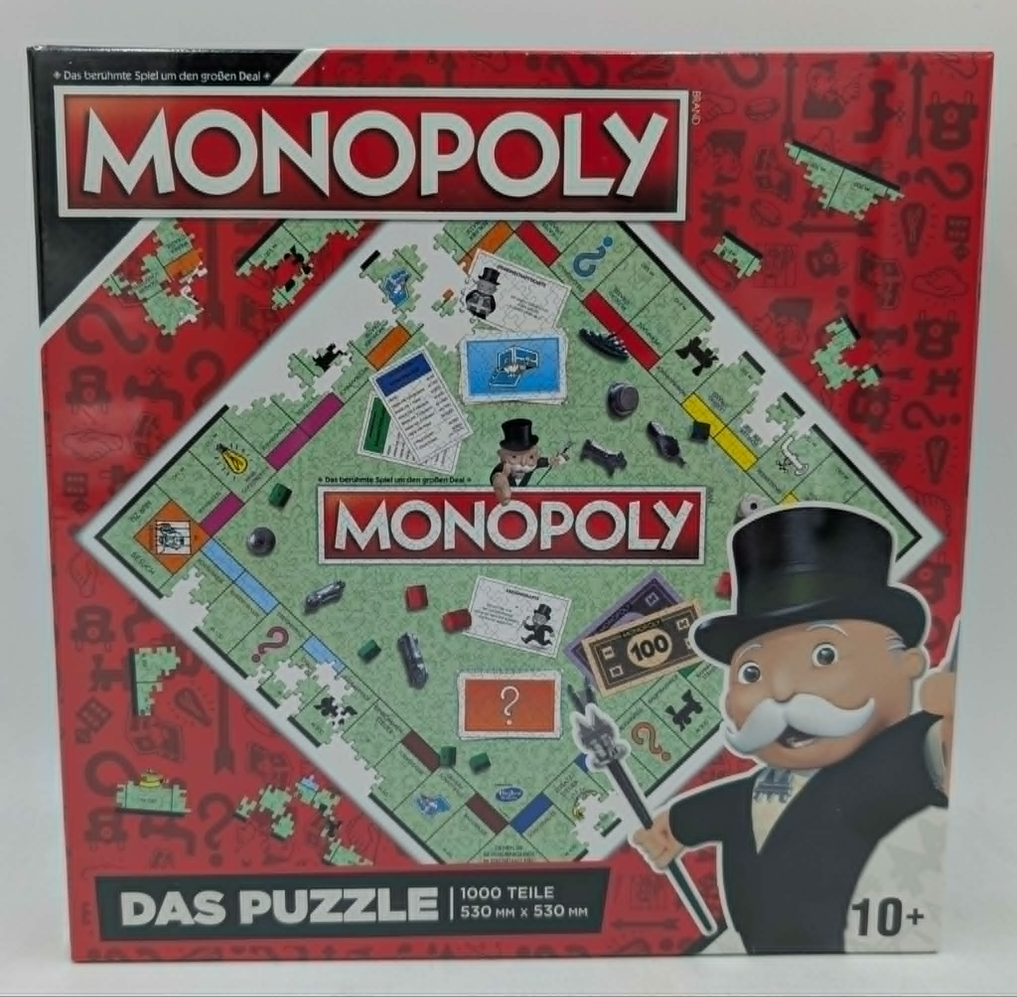 Monopoly Puzzle-Schachtel mit Mr. Monopoly und dem Spielbrett.