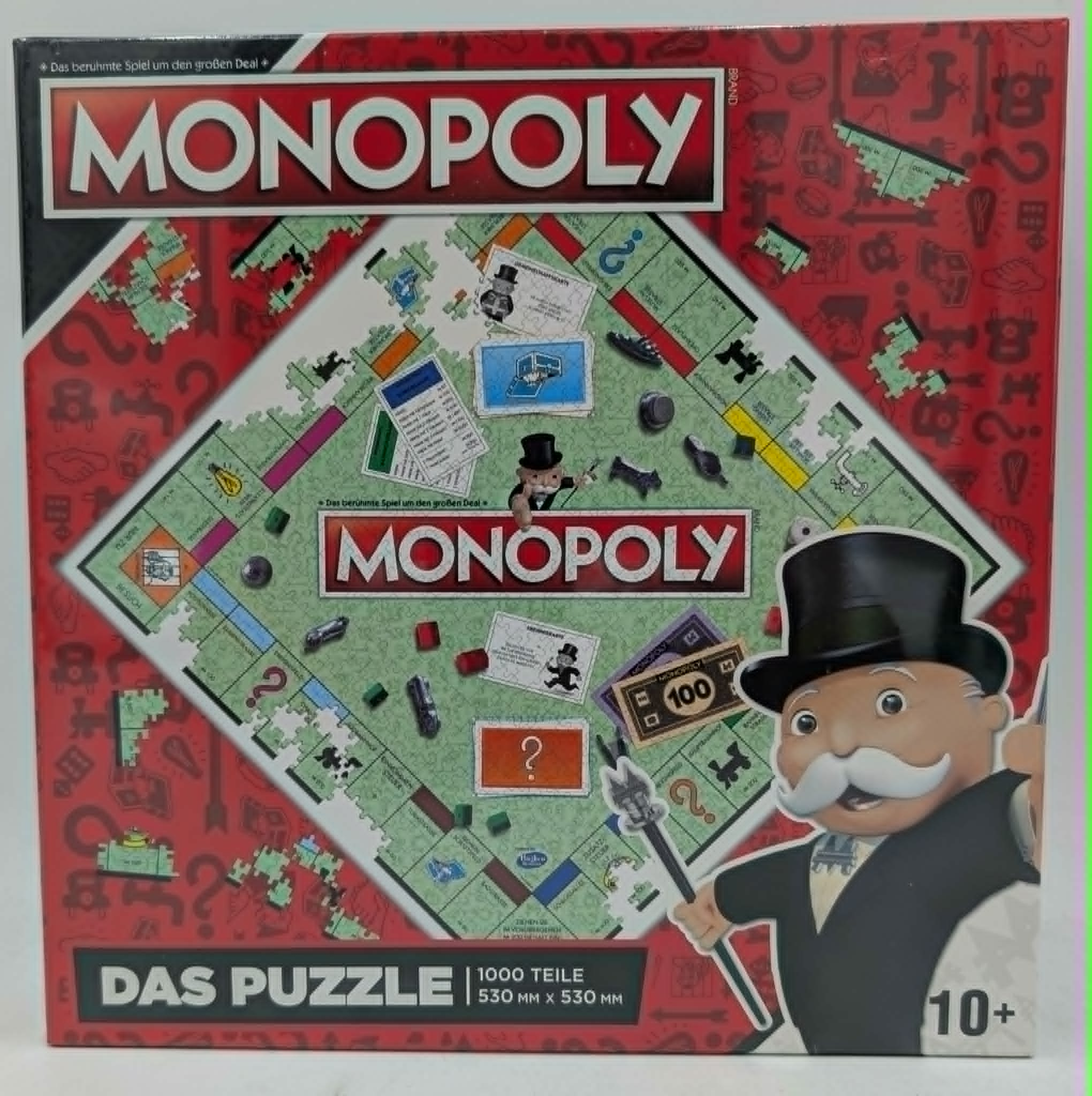 Monopoly Puzzle Box mit Mr. Monopoly und Spielbrett-Elementen.