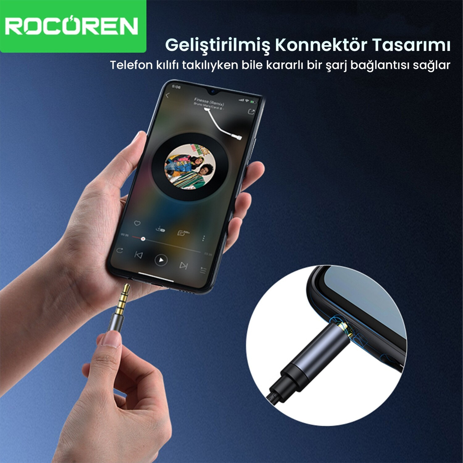 Bir el, müzik çalan telefona gri 3,5 mm'lik jak takıyor. Gelişmiş konektör.