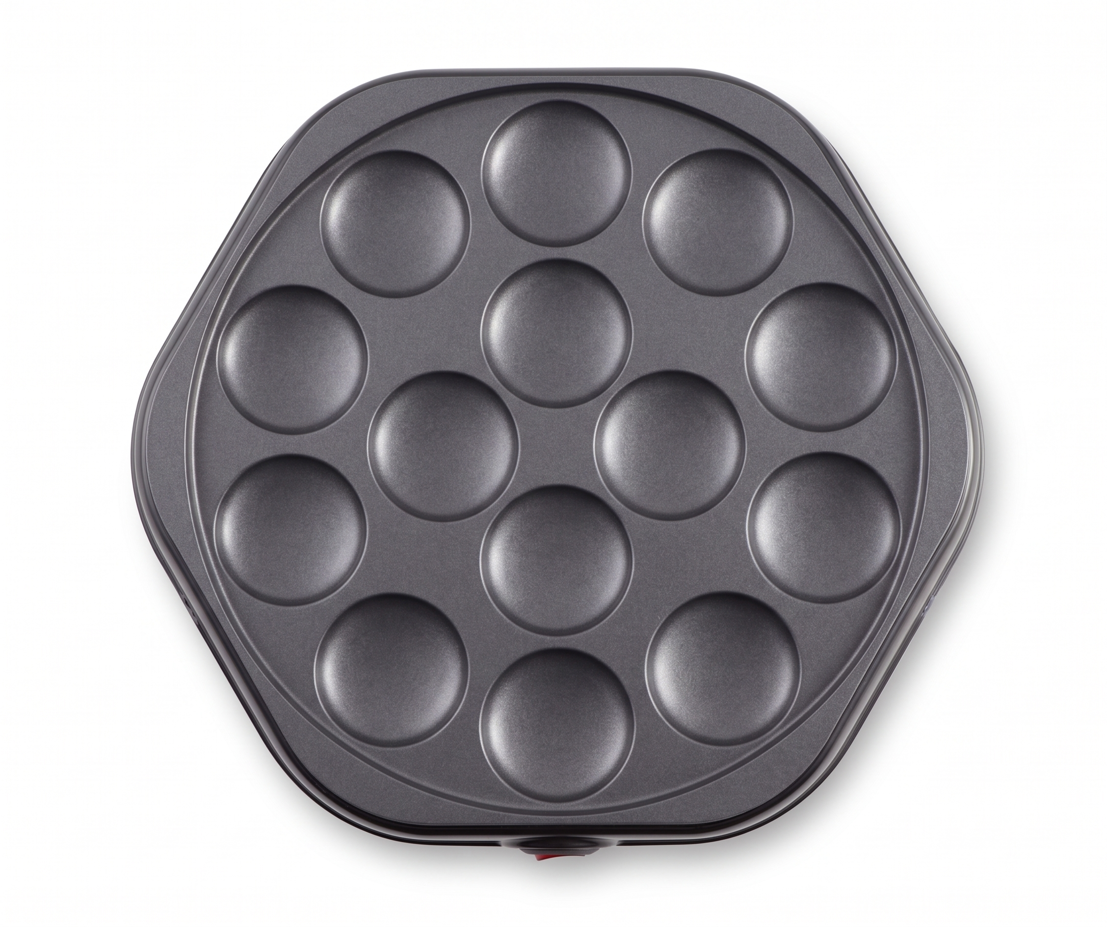 Gray pan with 12 round indentations and a red switch.