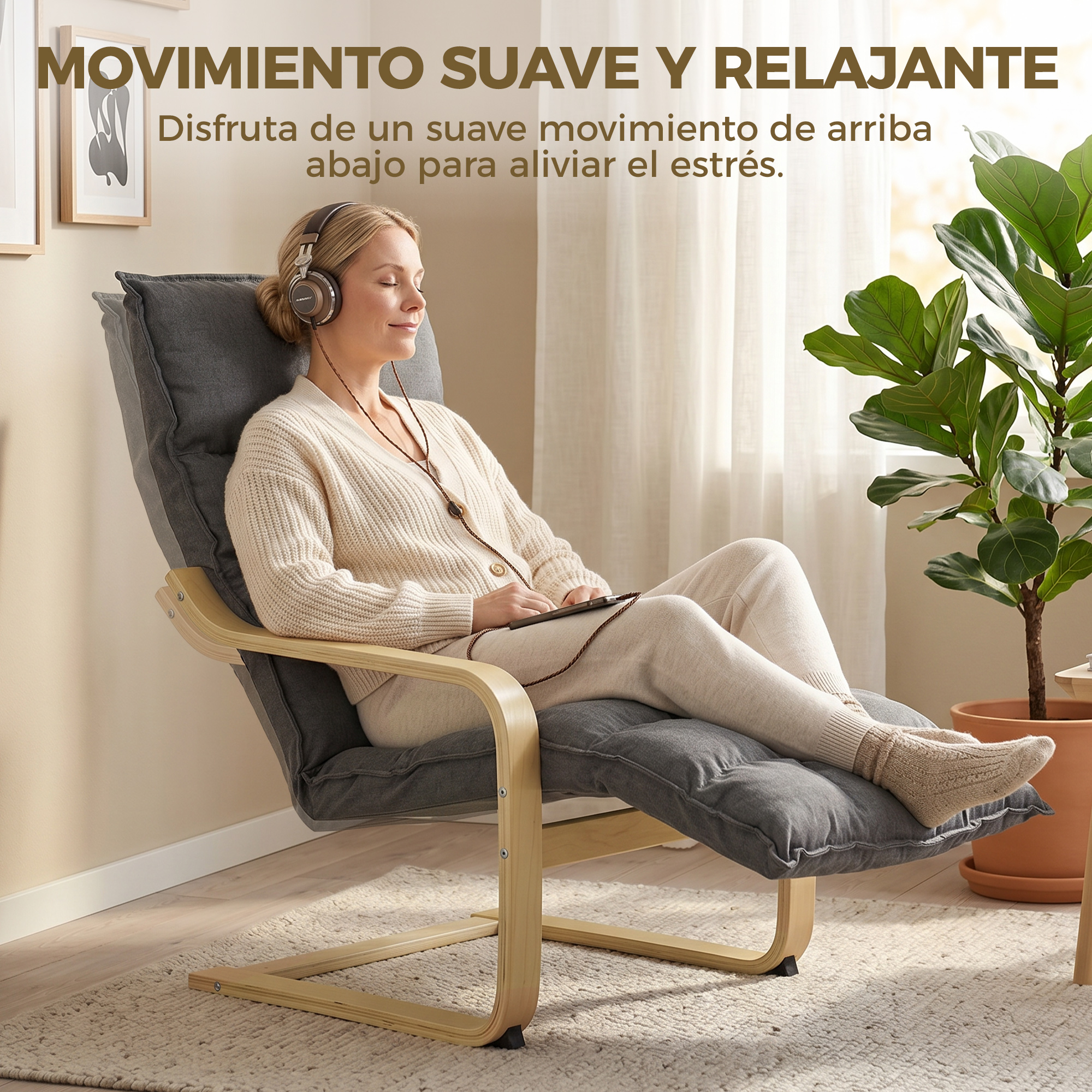 Una mujer con auriculares se relaja en una silla sosteniendo una tablet.