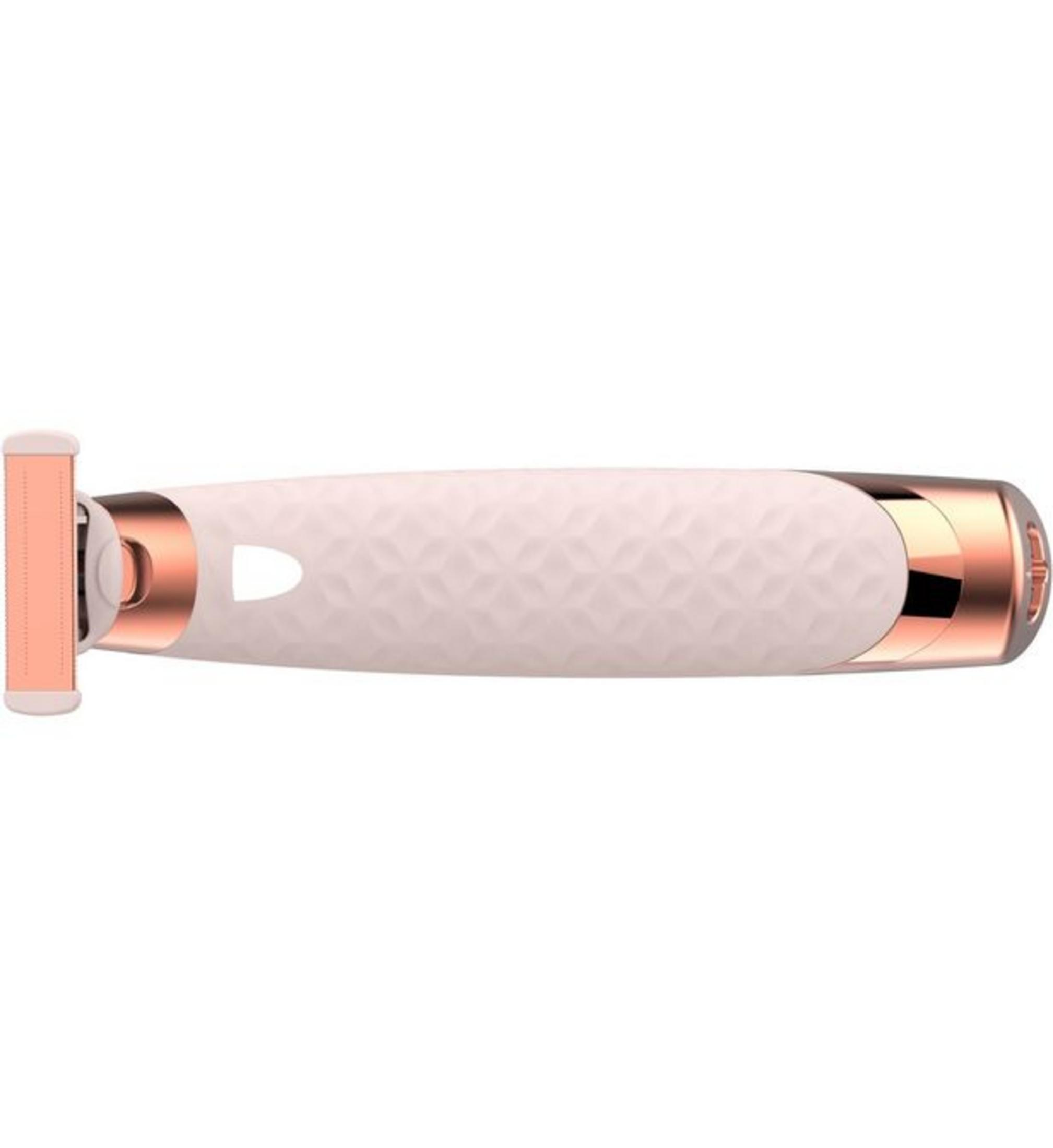 Un rasoio elettrico color oro rosa con manico bianco testurizzato.