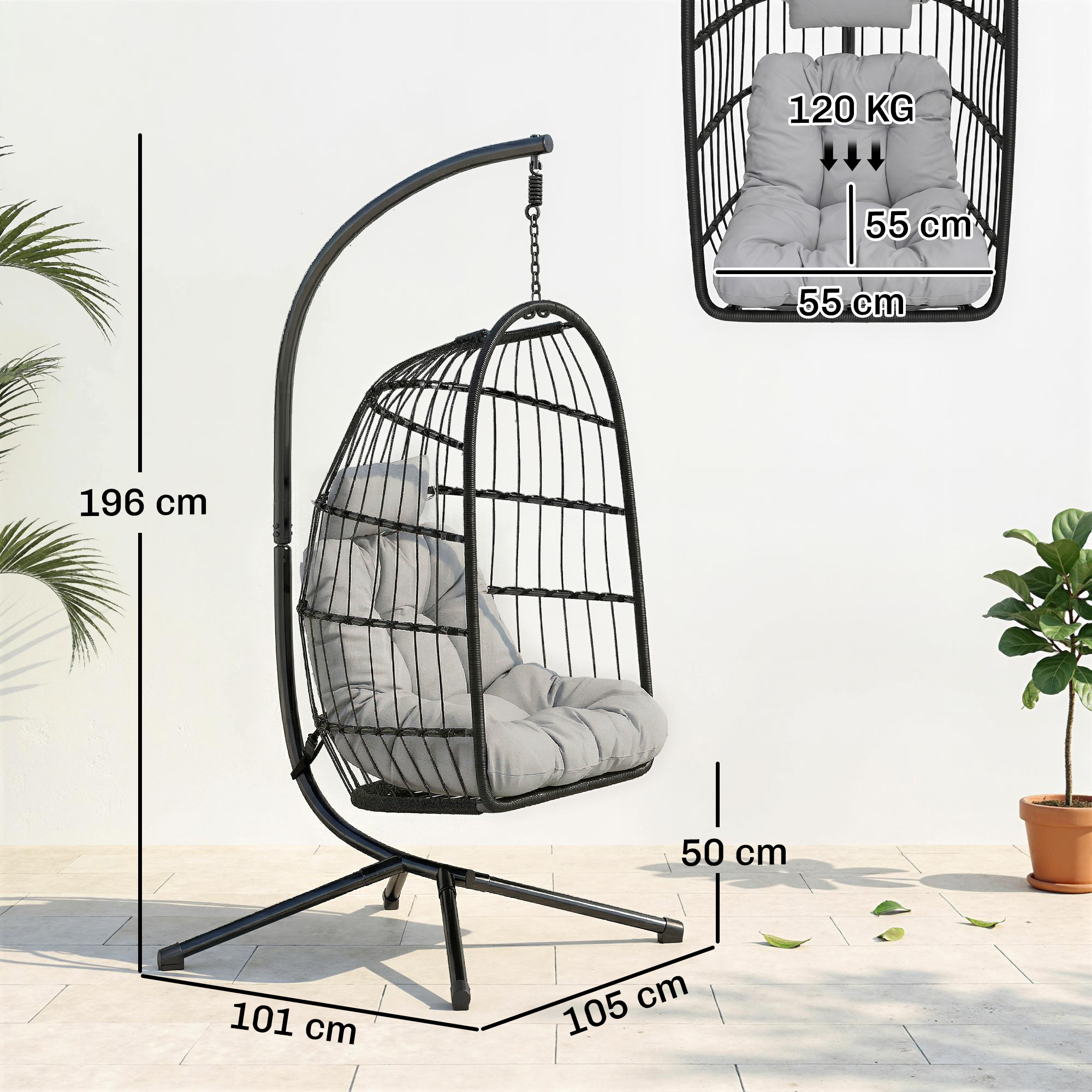 Una silla colgante negra con cojines grises se asienta sobre un patio embaldosado.