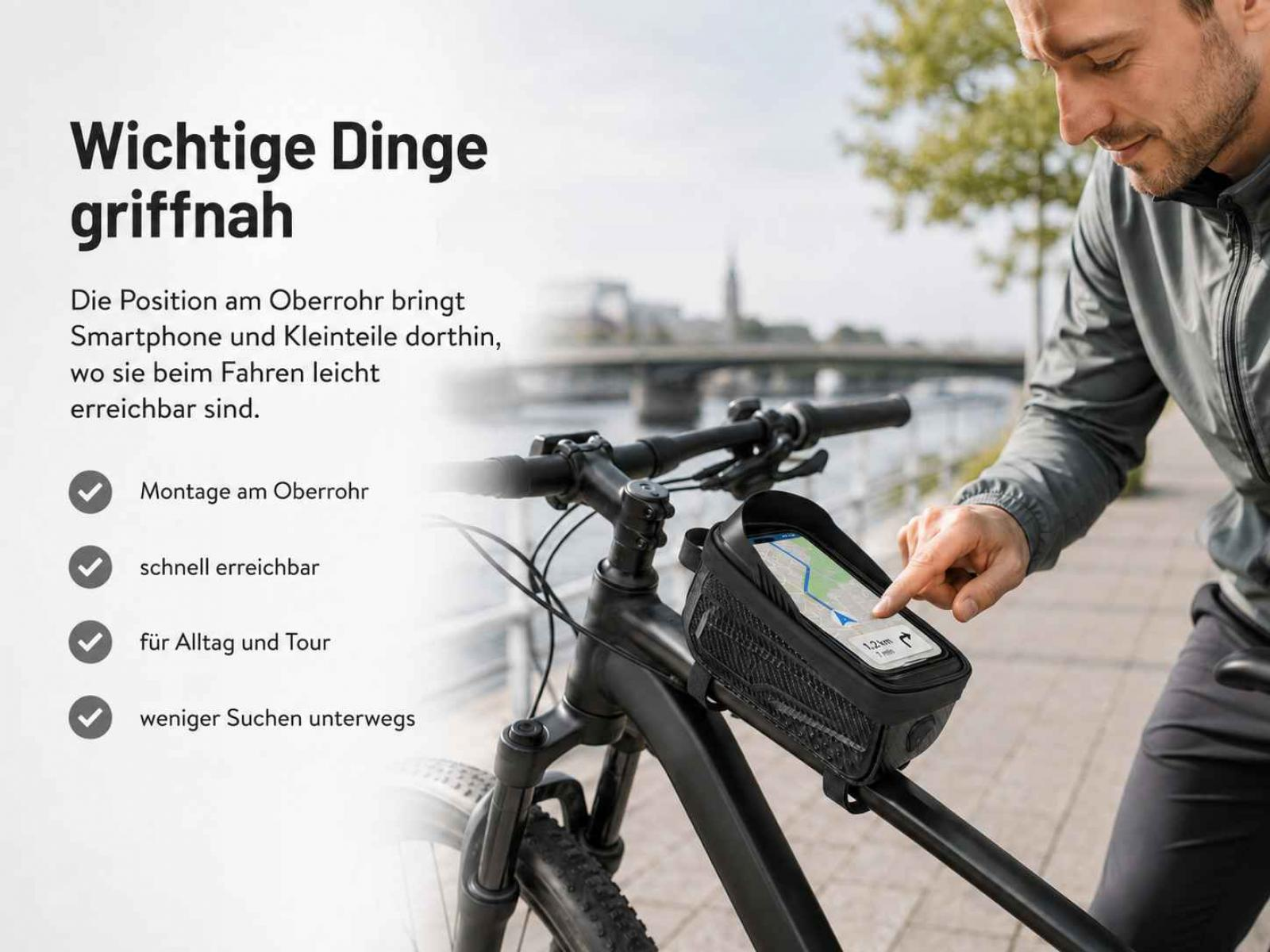 Ein Mann benutzt eine Fahrradtasche mit Handyhalterung am Oberrohr.