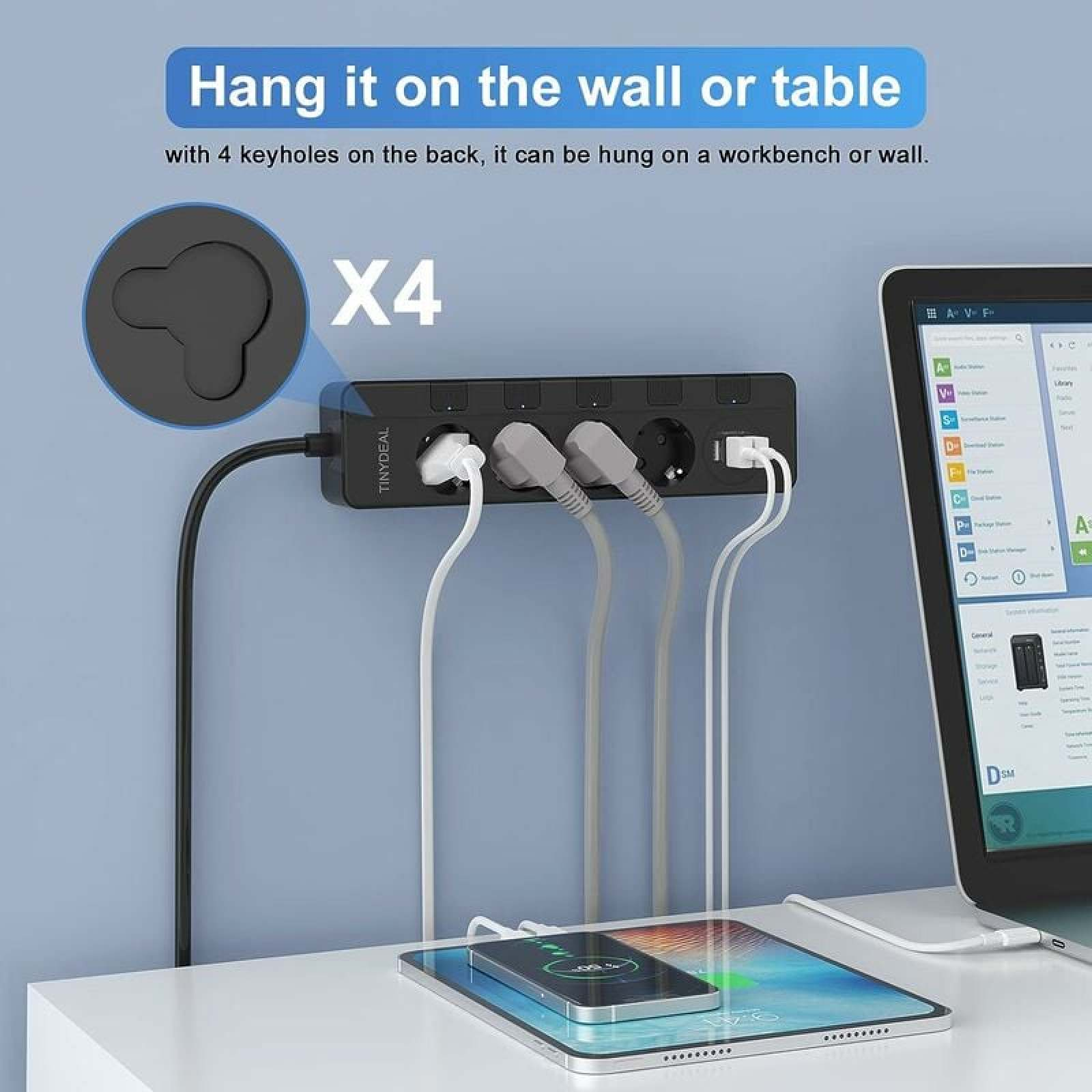 Schwarze Steckdosenleiste mit vier Anschlüssen, die ein Tablet und ein Smartphone lädt.