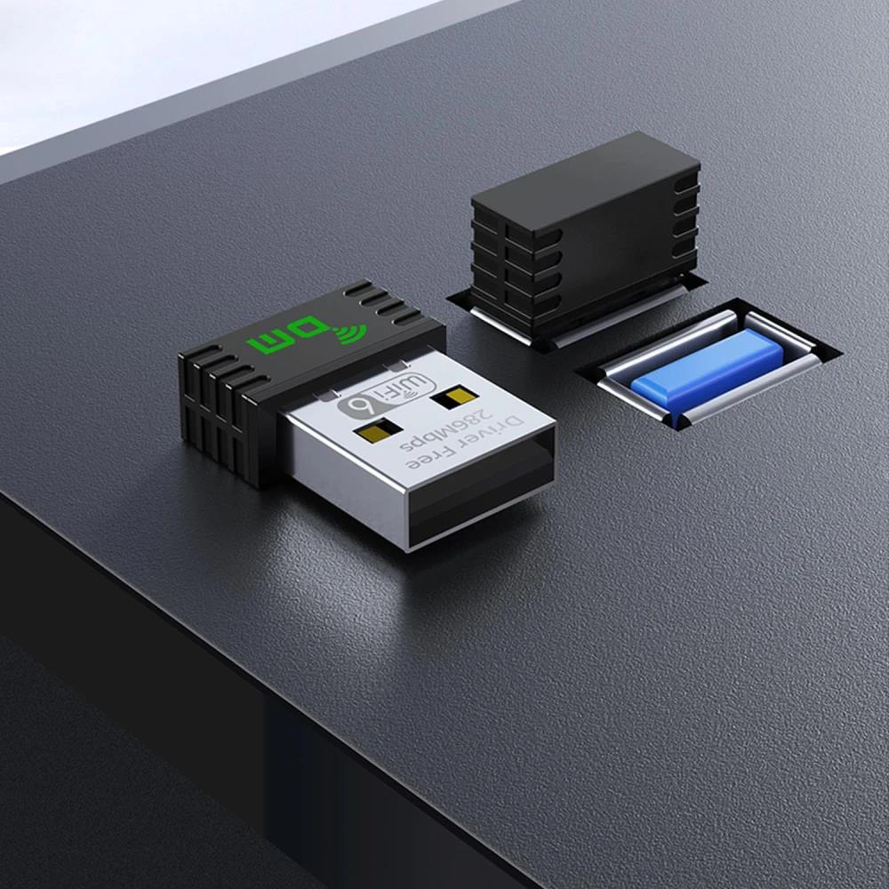 Yeşil logolu ve "Driver Free 286mbps" yazılı siyah WiFi 6 USB adaptörü.