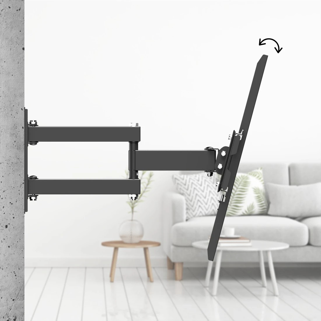 Support mural TV noir avec bras extensible, fixé à un mur en béton.