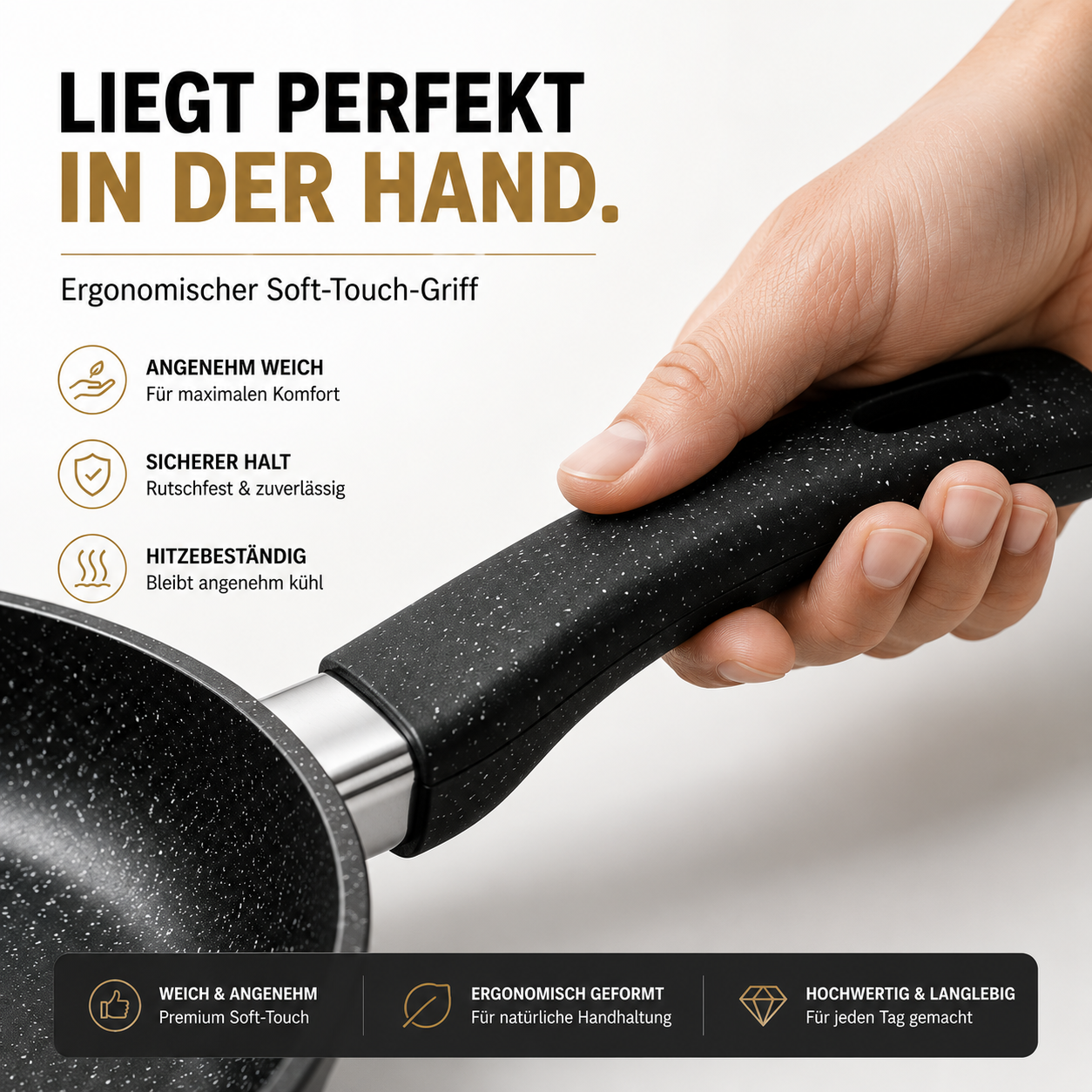 Eine Hand hält den schwarzen Griff einer Pfanne mit Steinchen-Muster.