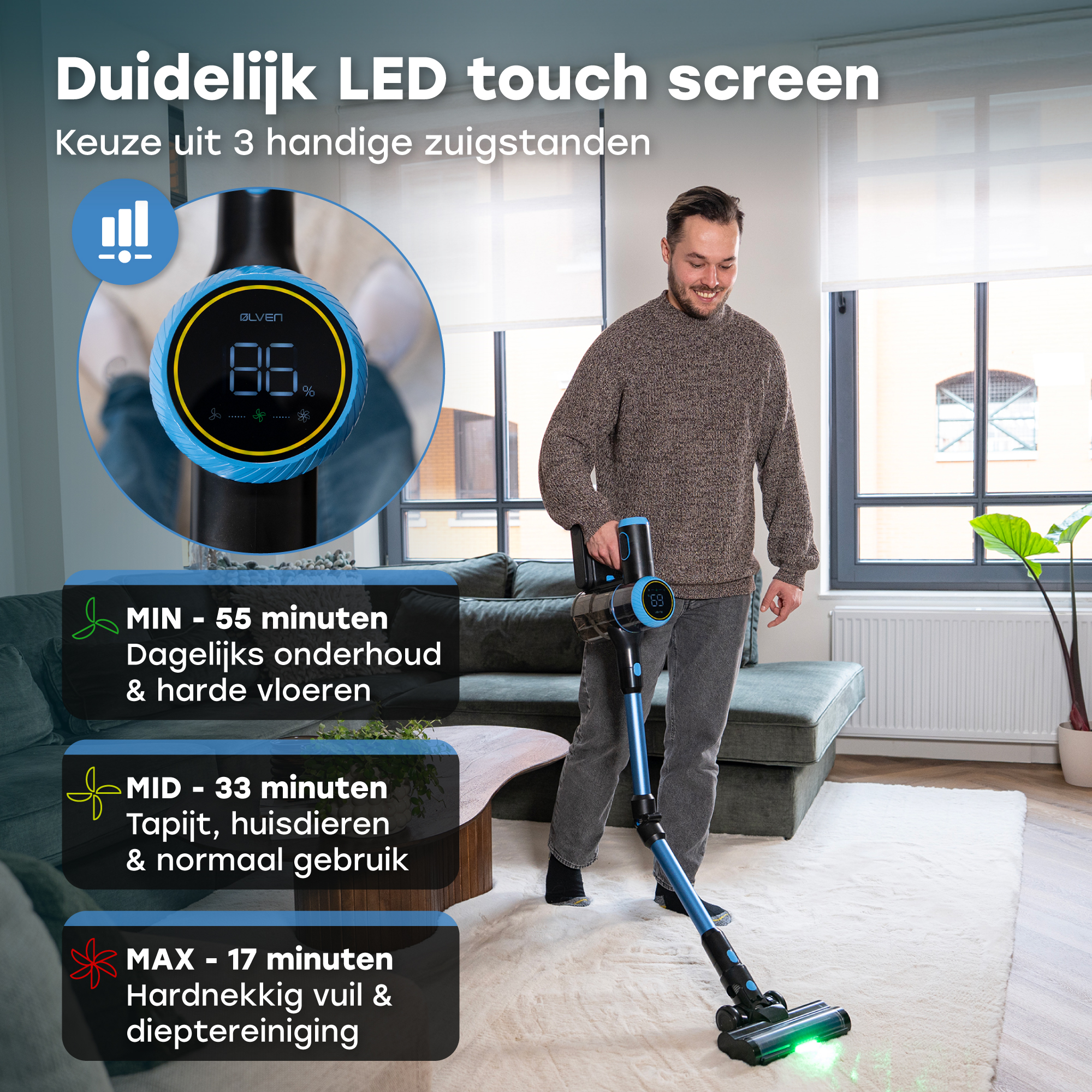 Man with a blue vacuum cleaner in a living room, LED screen shows 86%.