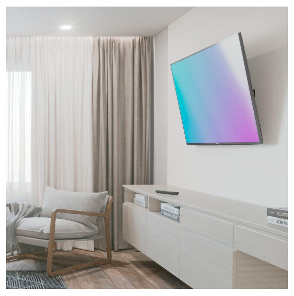 Un televisor con degradado de color cuelga de una pared blanca sobre un mueble blanco.