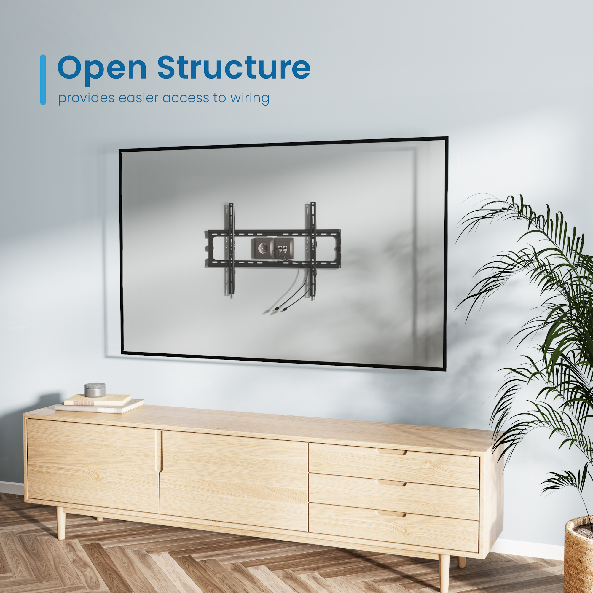 Ein TV-Wandhalter mit Kabeln ist an der Wand montiert. Ein Holzschrank steht darunter.
