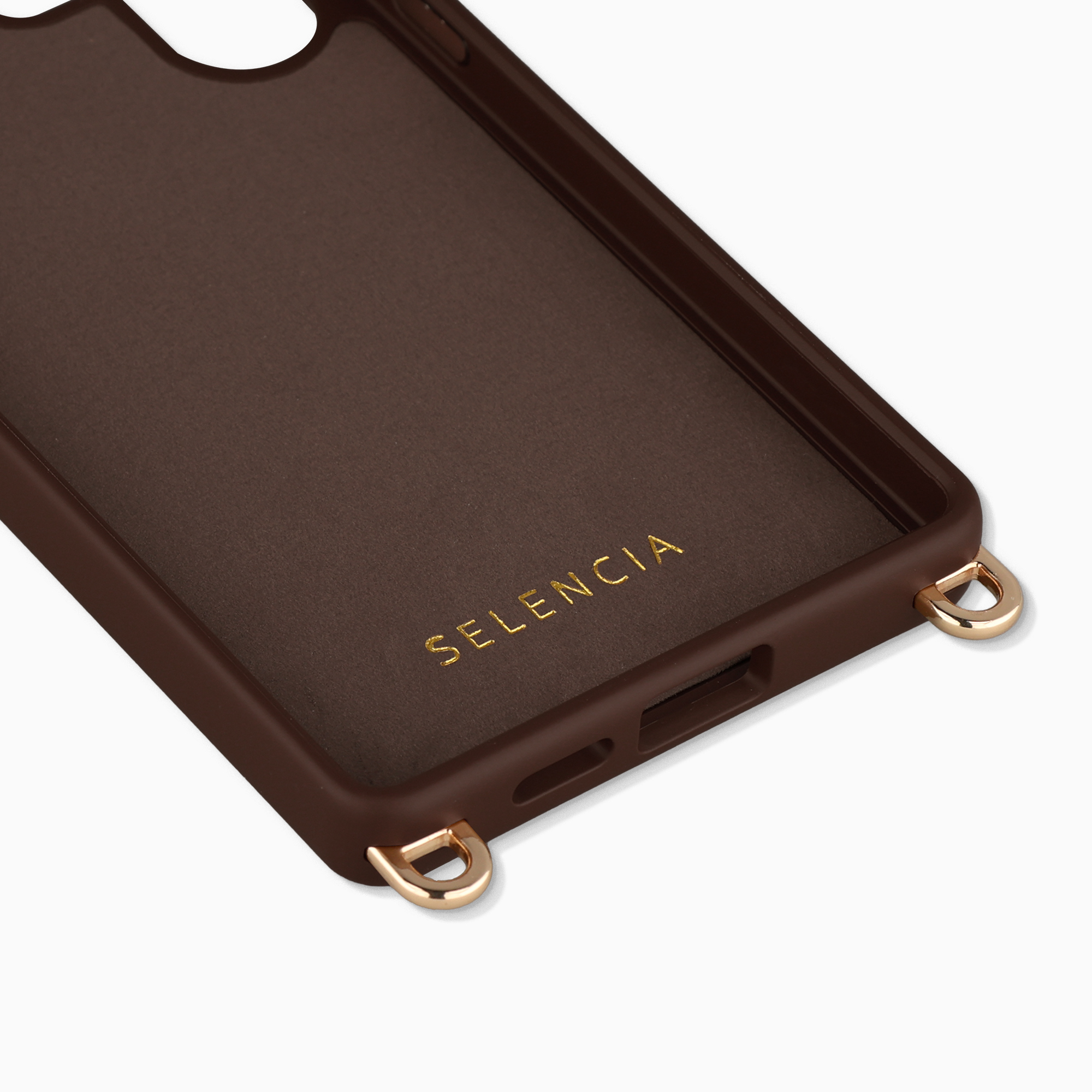 Coque de téléphone marron foncé avec boucles dorées et logo SELENCIA.