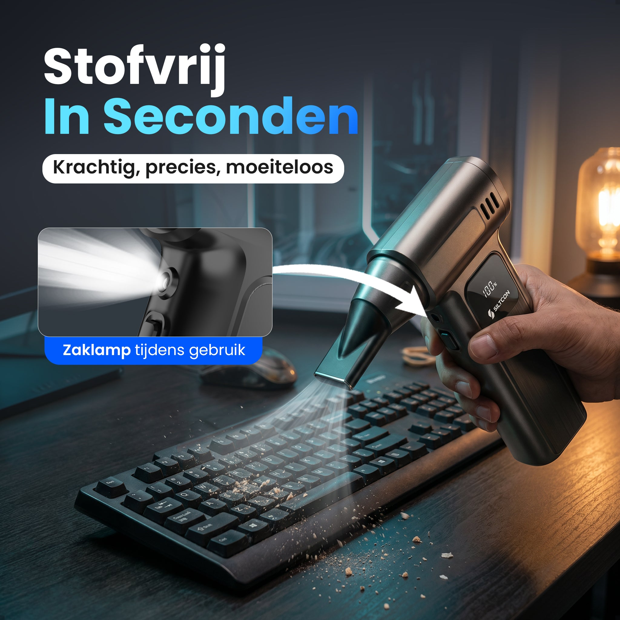 A handheld vacuum cleans a keyboard. A beam of light is visible.
