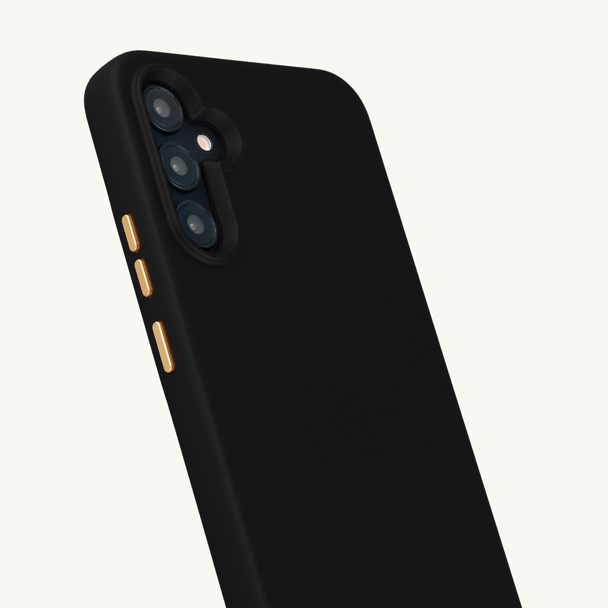 Funda de teléfono negra con recorte de cámara y botones dorados sobre fondo blanco.