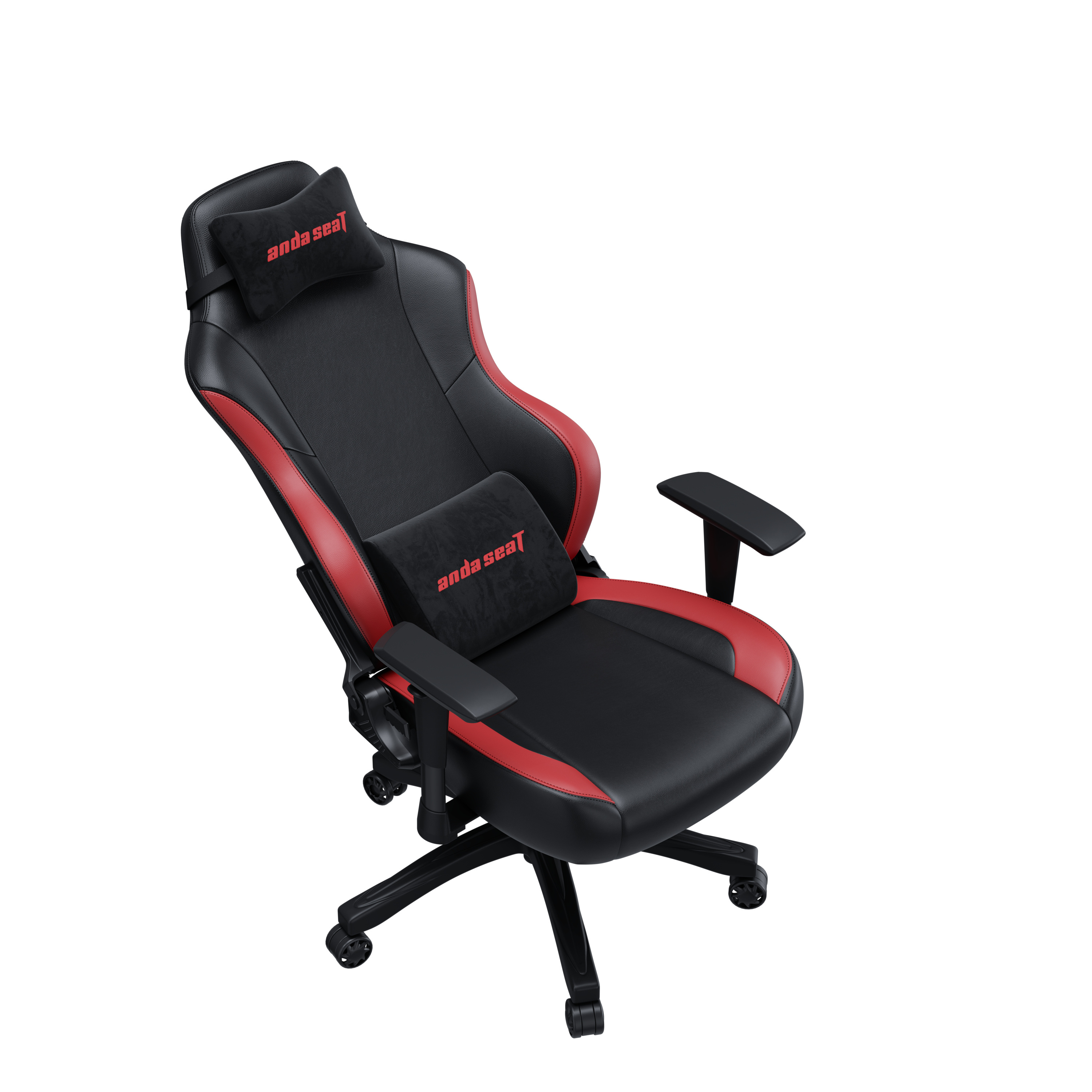 Sedia da gaming nera con accenti rossi e due cuscini.