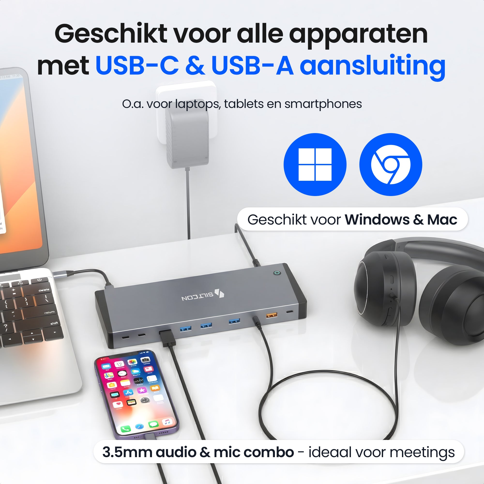 Un ordinateur portable, un smartphone, un hub USB et un casque sur un bureau.
