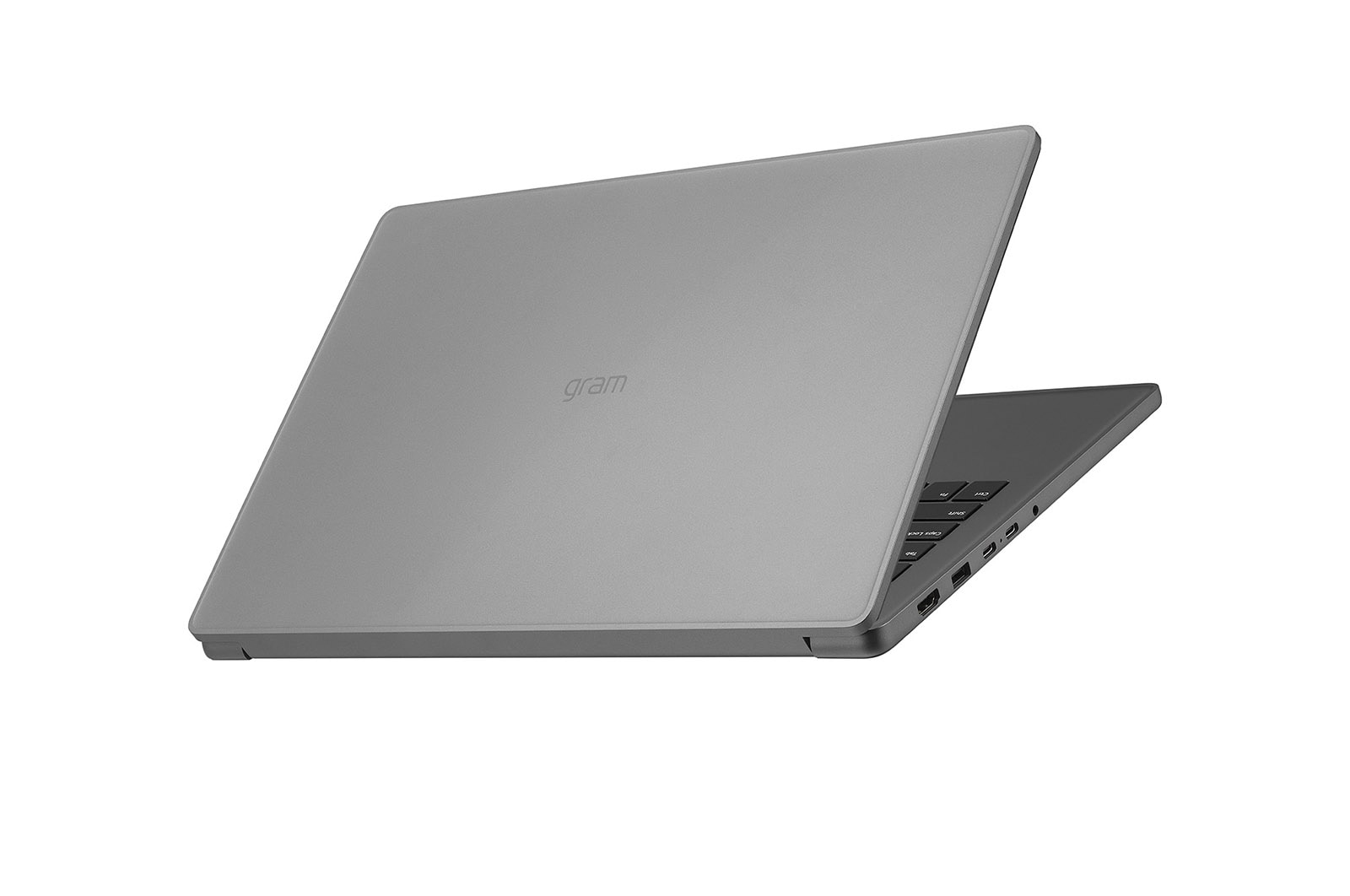 Un laptop grigio chiuso con il logo 'gram' sul coperchio.