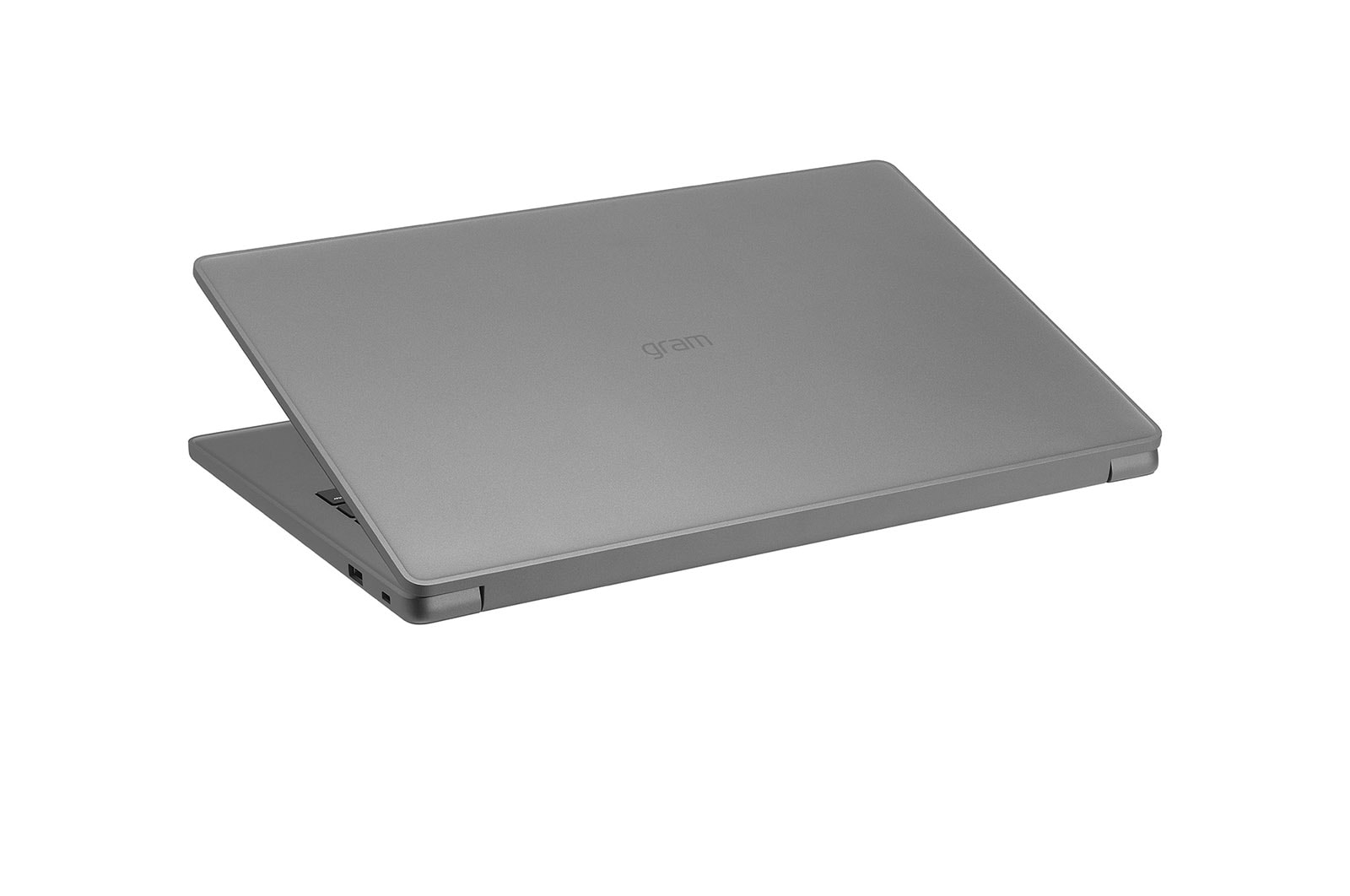 Un laptop grigio chiuso con il logo "gram" sul coperchio.