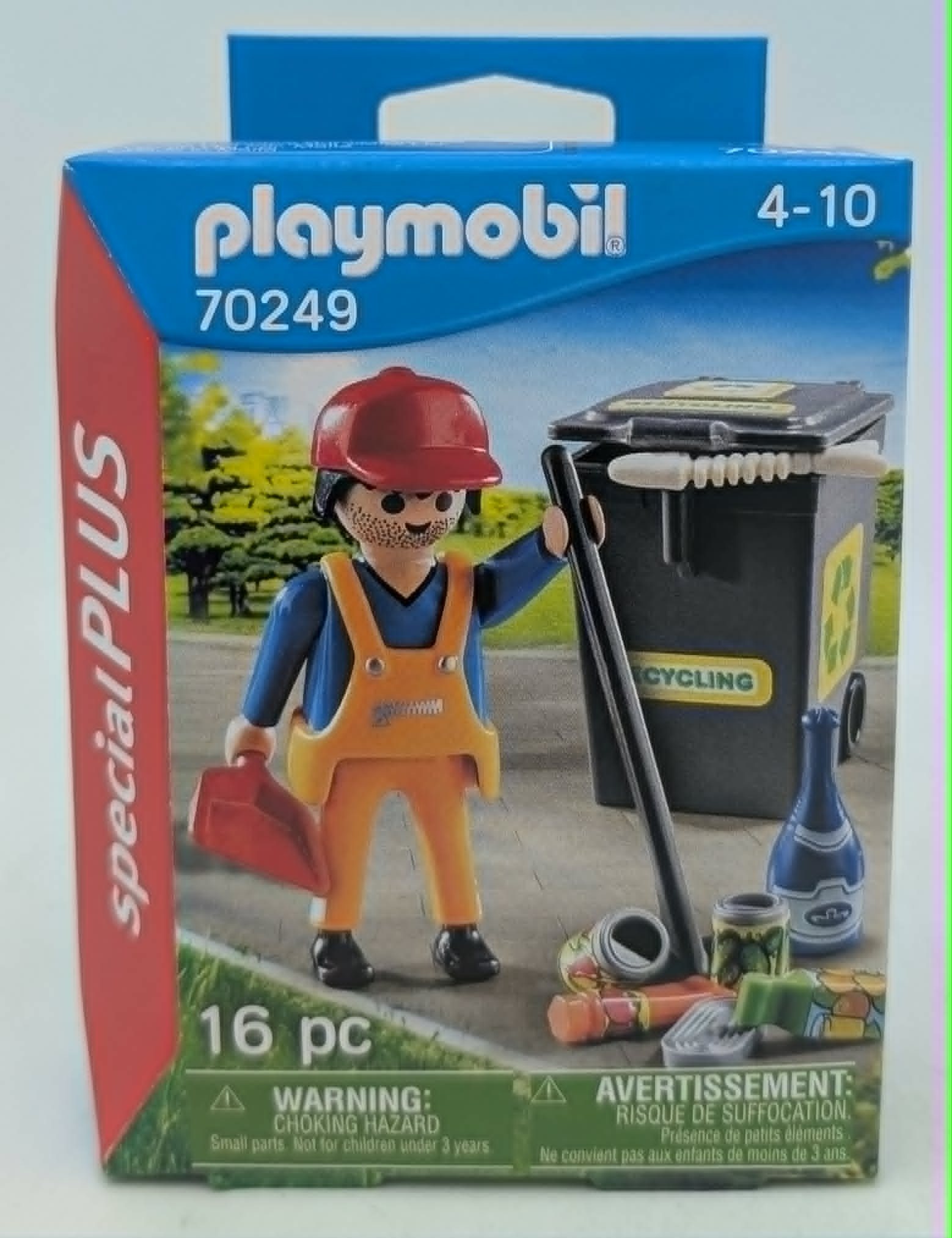 Scatola Playmobil con figura di netturbino, bidone riciclaggio e attrezzi.